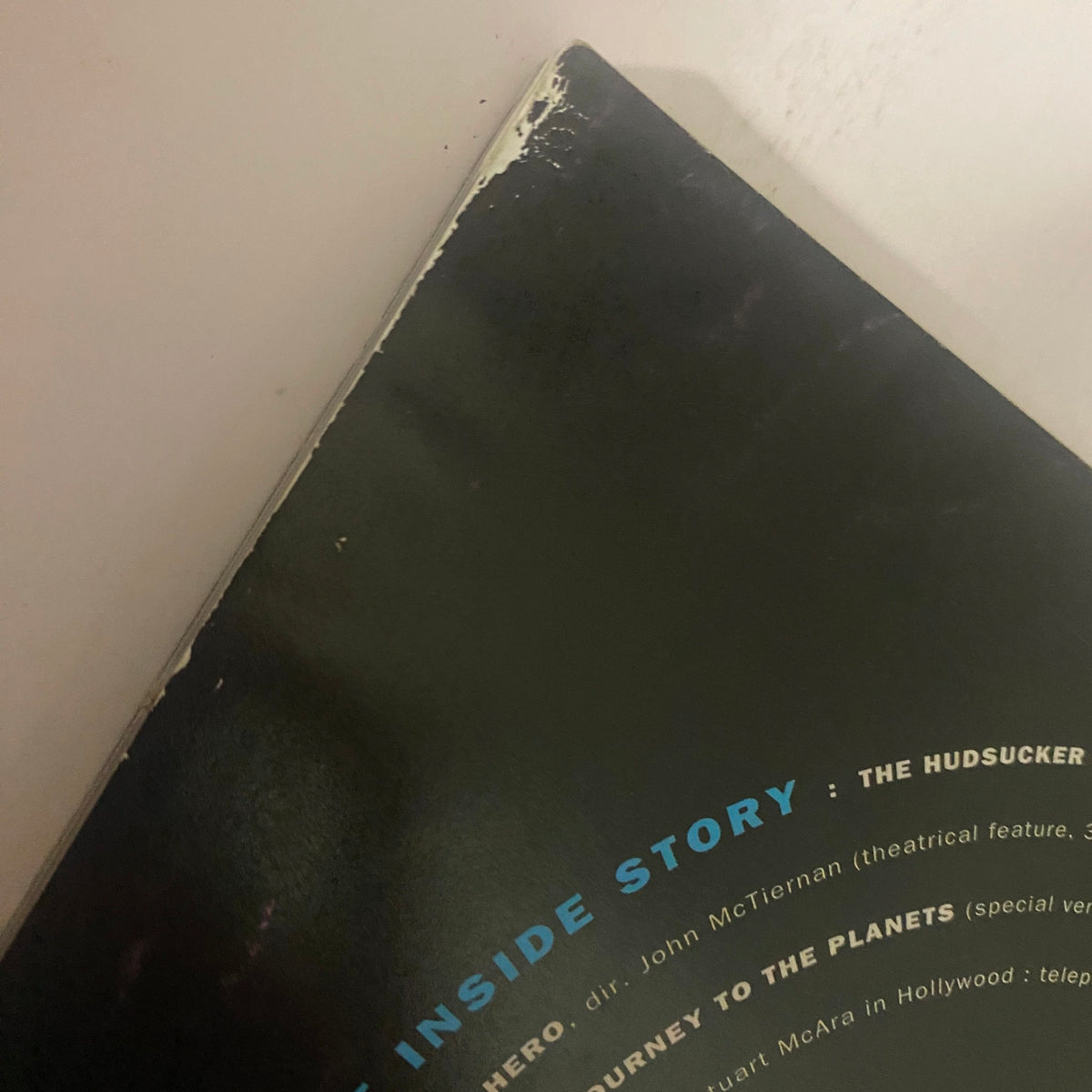 Close-up image of the spine of Cinefex Magazine August 1993 No. 55, showing wear and tear at the top edge, showcasing its vintage condition relevant to collectors.