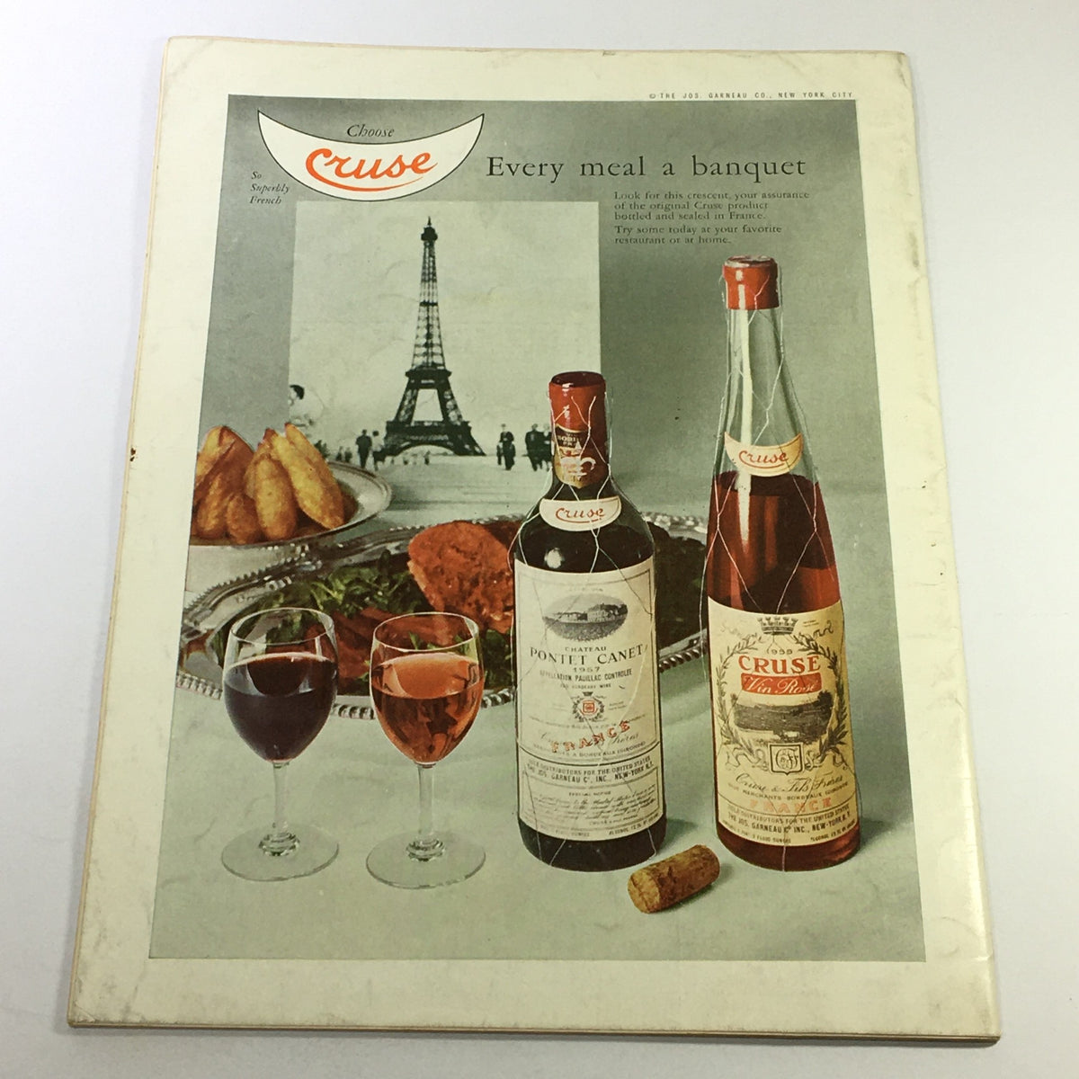 Back cover of VTG Gourmet The Magazine of Good Living July 1962 advertising Cruse wines with an image of the Eiffel Tower and various food items.