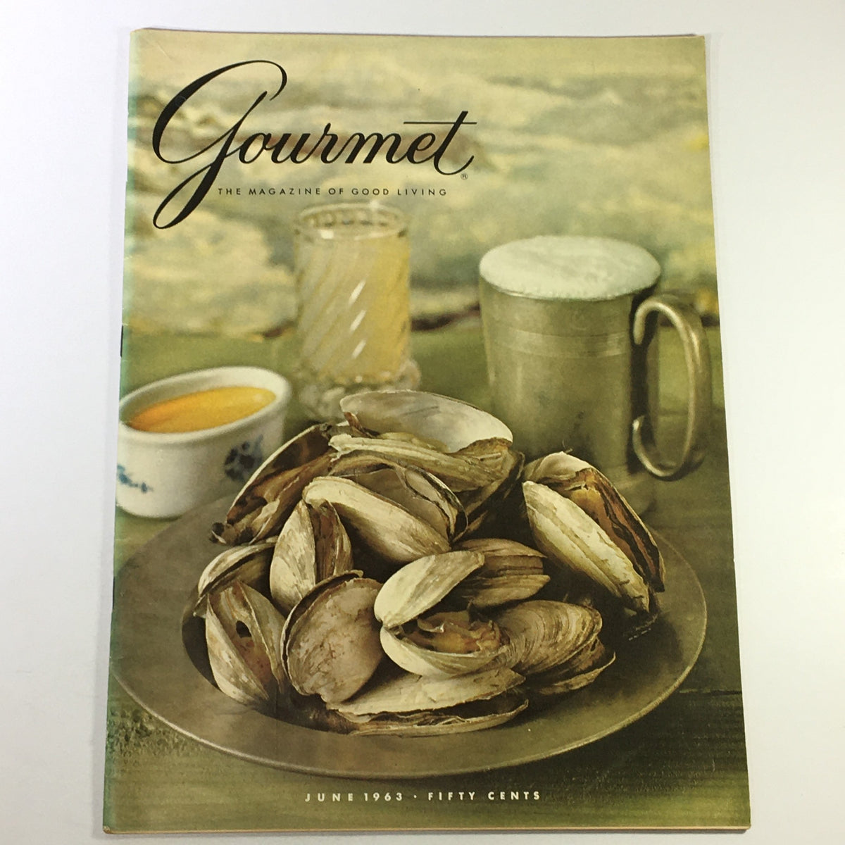 Cover of VTG Gourmet: The Magazine of Good Living, June 1963 edition, showcasing a plate of freshly harvested clams with drinks, reflecting the culinary trends of the 1960s.
