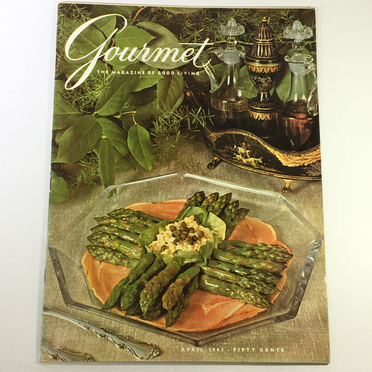 Vintage Gourmet magazine cover from April 1963 featuring a gourmet dish of asparagus with ham titled 'Bouquets for Ham'. A nostalgic look at 1960s culinary art.