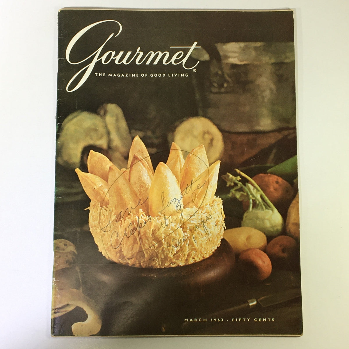 Cover of the VTG Gourmet Magazine of Good Living from March 1963 featuring a lavish dessert and vegetables, showcasing the beauty of Lake District.