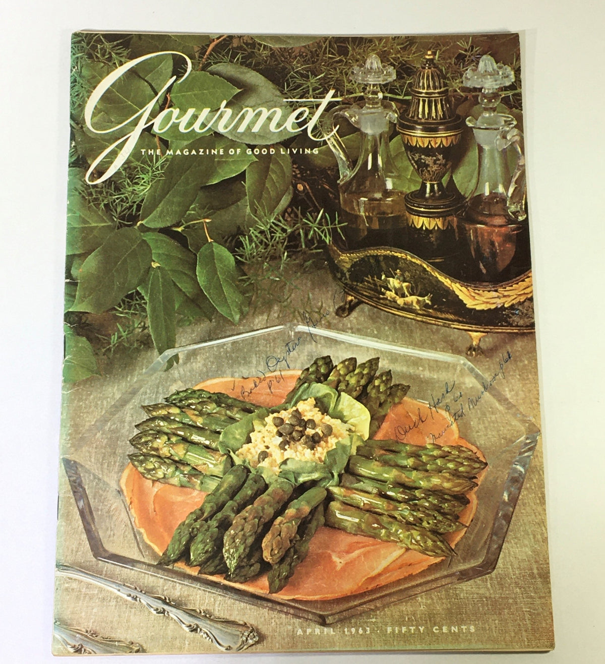 Cover of VTG Gourmet The Magazine of Good Living April 1963 featuring a beautifully arranged dish with asparagus and egg salad on a glass platter, embodying the elegance of mid-20th century dining.