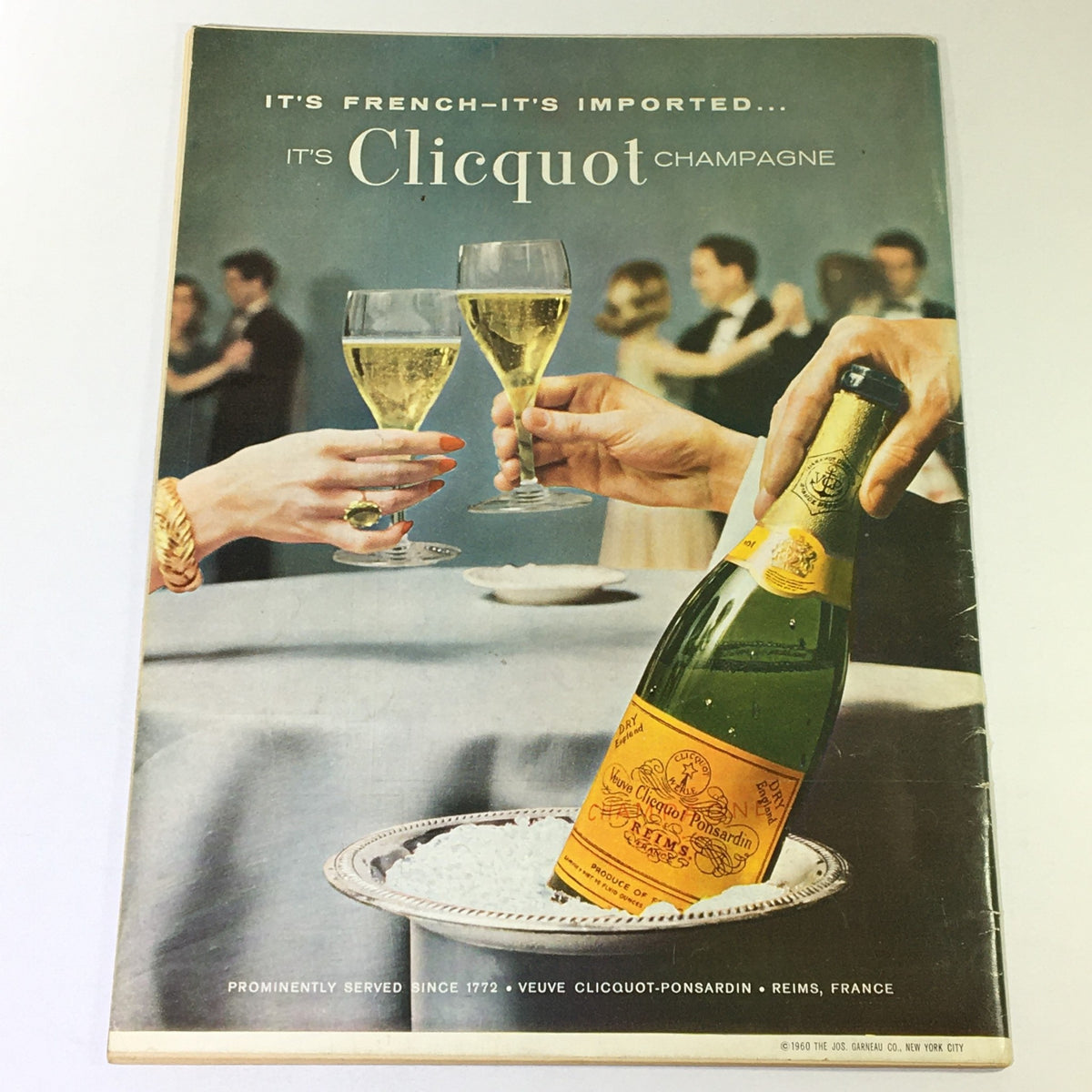 Vintage magazine cover of VTG Gourmet: The Magazine of Good Living from April 1963 featuring a lavish scene of toasting with glasses of Clicquot champagne in a social setting, highlighting refined dining and lifestyle trends of the early 60s.