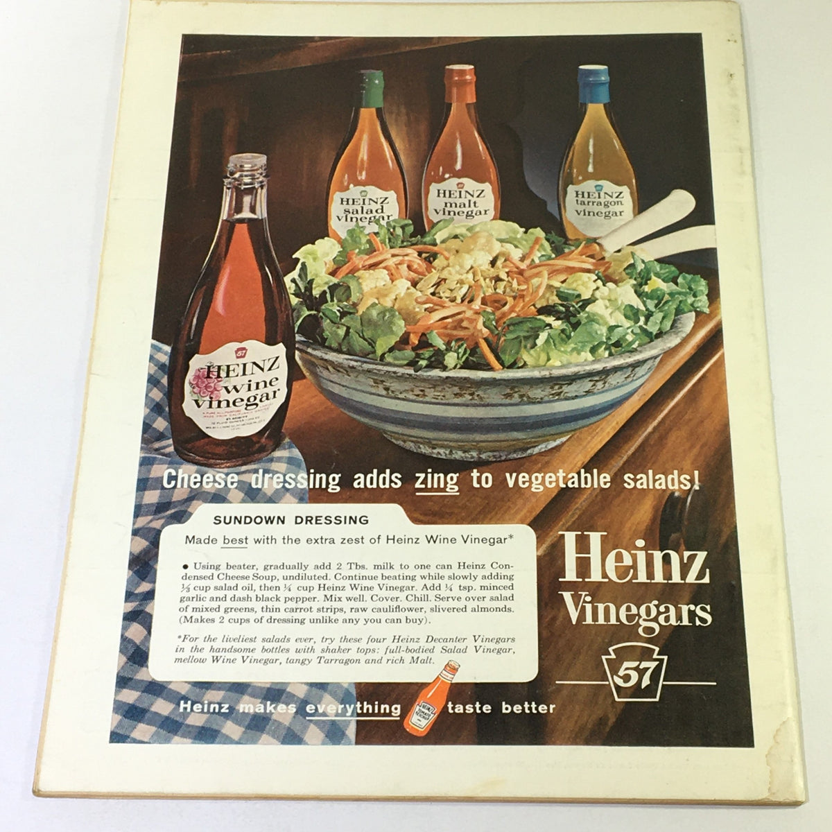 Ad page from VTG Gourmet The Magazine of Good Living August 1963 showcasing Heinz Vinegars with a colorful salad, emphasizing the use of condiments in enhancing flavor.