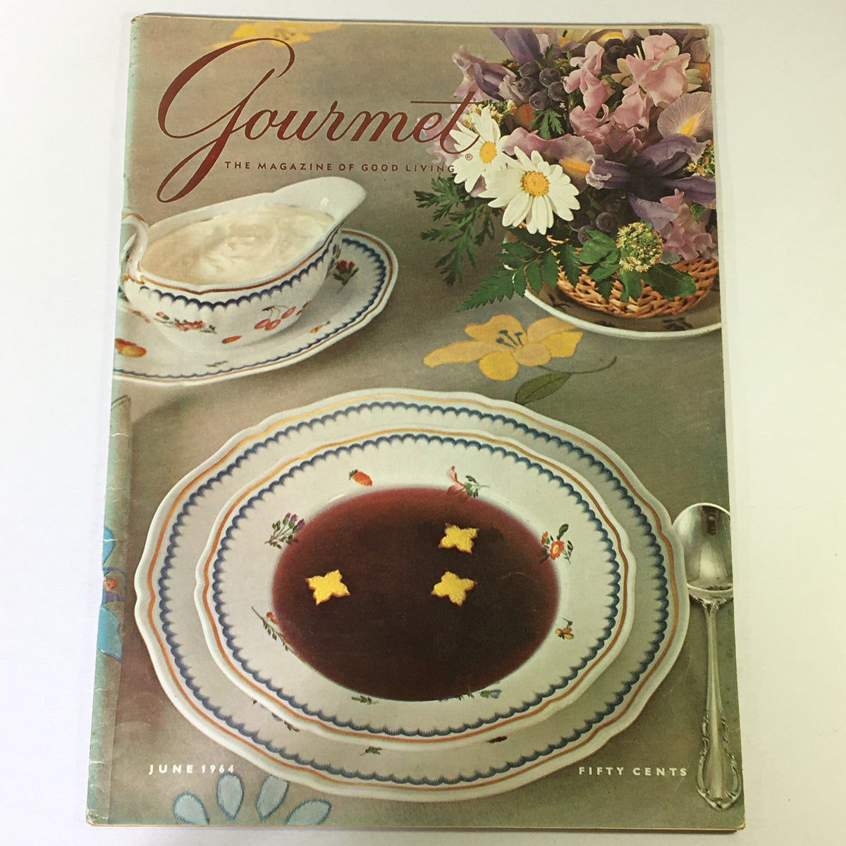 Cover of VTG Gourmet The Magazine of Good Living - June 1964 featuring a beautifully arranged table setting with fine china, a bowl of soup, and a bouquet of flowers, embodying culinary elegance.