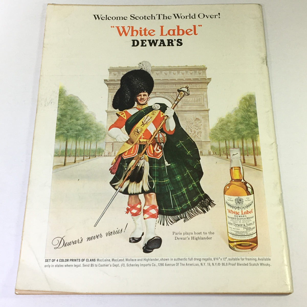 Back cover of VTG Gourmet The Magazine of Good Living - June 1964, promoting 'White Label' Dewar's Scotch whisky with an illustration of a Highlander in traditional attire, set against a Parisian backdrop.