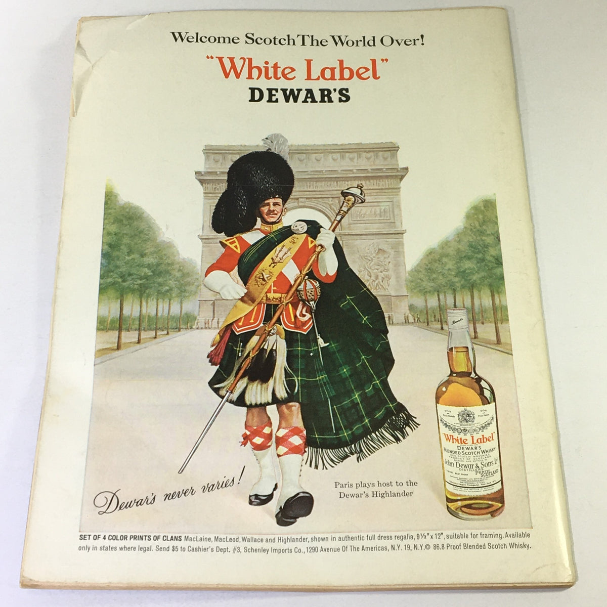 Back cover of VTG Gourmet: The Magazine of Good Living, June 1965 edition showcasing an advertisement for Dewar's White Label Scotch Whisky, featuring a Highlander dressed in traditional attire.