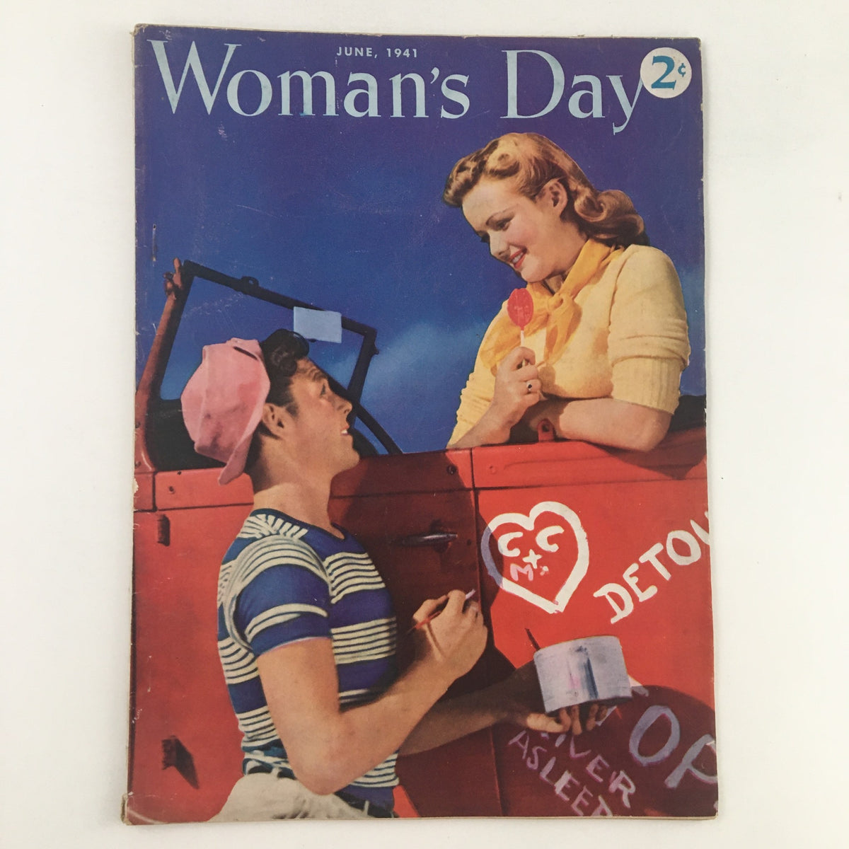 Cover of Woman's Day Magazine June 1941 featuring a couple, with the woman in a yellow sweater and the man in a striped shirt and pink cap, highlighting a nostalgic moment from mid-20th century life.