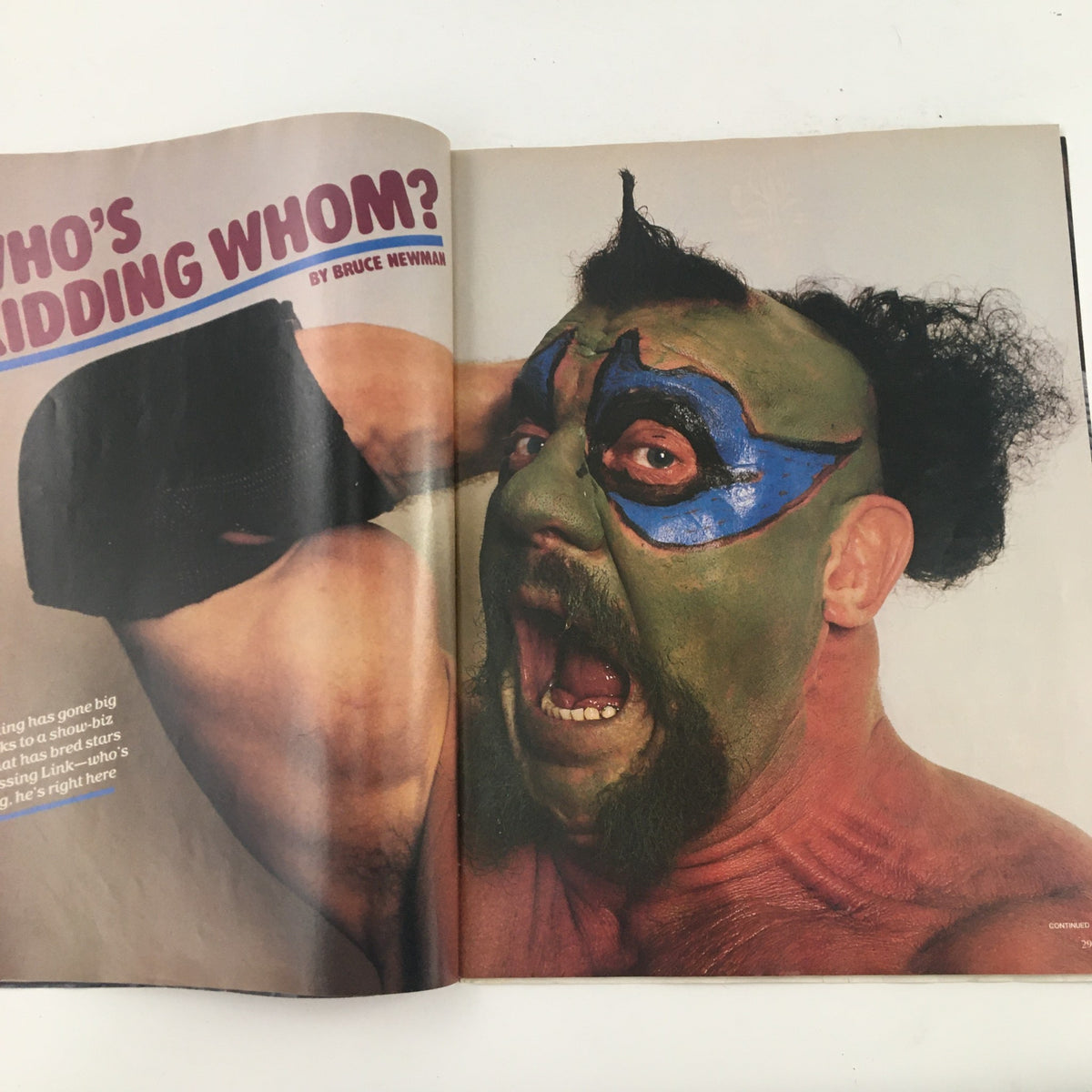 Close-up of a wrestler with green face paint in Sports Illustrated Magazine April 29 1985, represents the excitement and characters in 1980s professional wrestling.