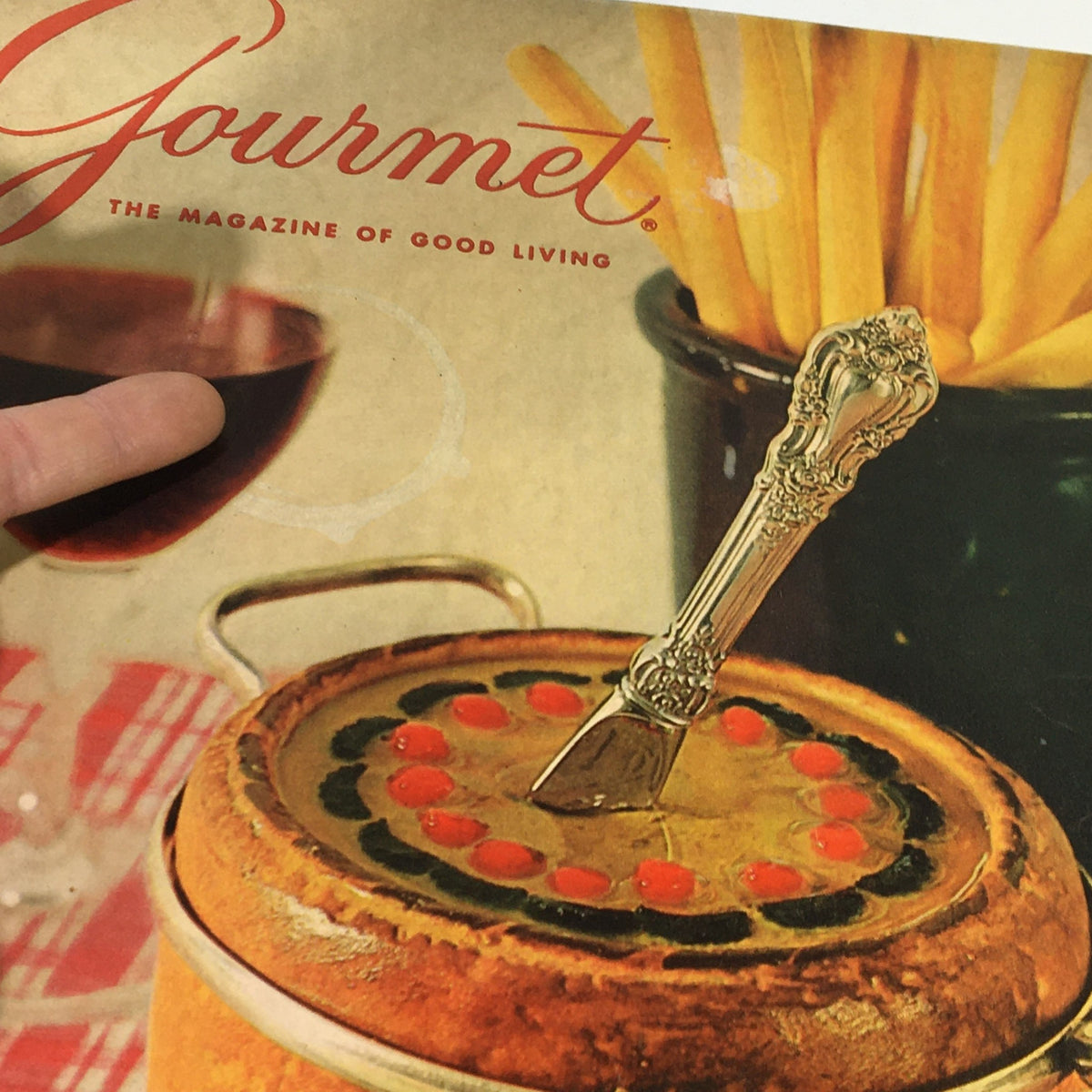 Close-up of VTG Gourmet The Magazine of Good Living September 1965 cover featuring an elegant dish topped with colorful ingredients, set against a backdrop of a wine glass and French fries.