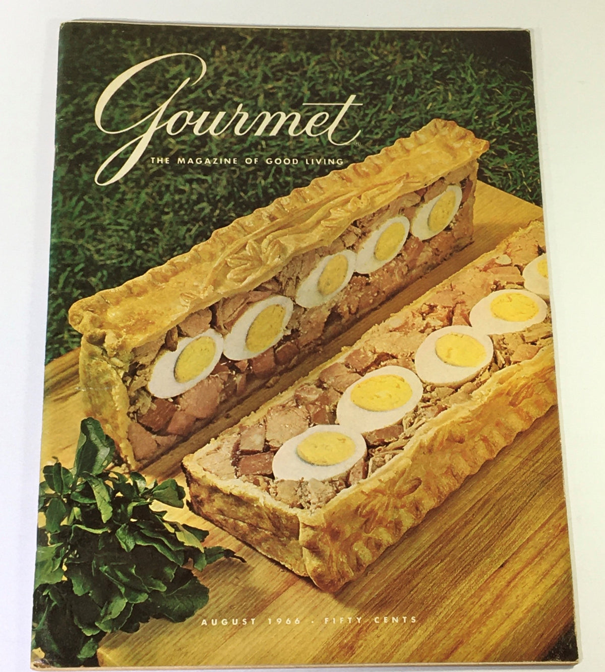 Cover of VTG Gourmet The Magazine of Good Living August 1966 featuring a savory dish with sliced eggs and meats, showcasing the culinary delights of the era.