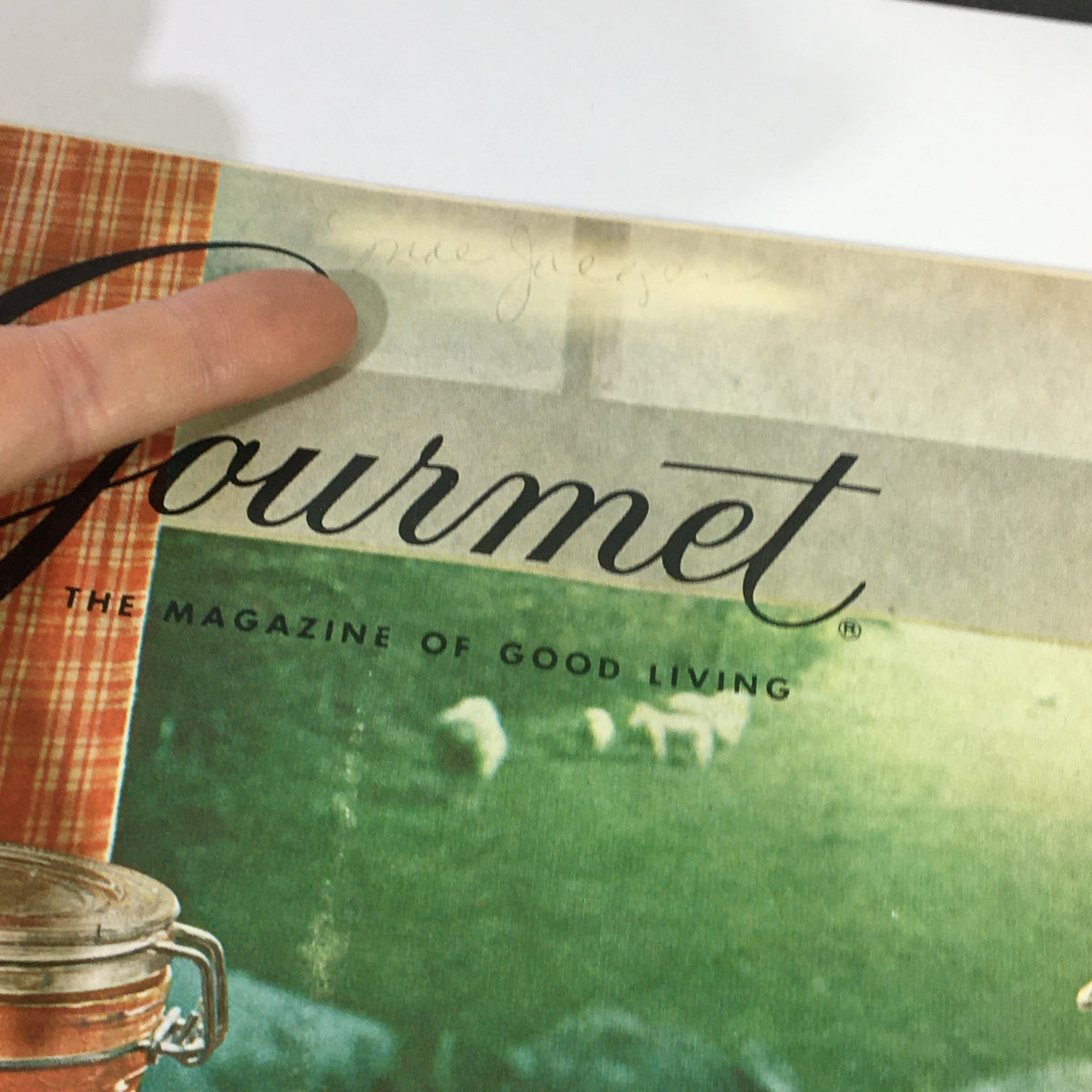 Close-up of the cover of VTG Gourmet The Magazine of Good Living August 1967 showing the magazine title and vintage design, along with a finger pointing to handwritten notes in the corner.
