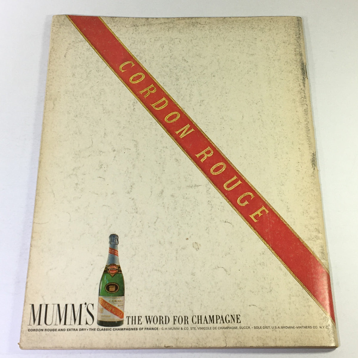 Back cover of VTG Gourmet The Magazine of Good Living March 1969 showcasing a vintage design with a red band reading 'Cordon Rouge' and an illustration of a champagne bottle, reflecting the gourmet theme.