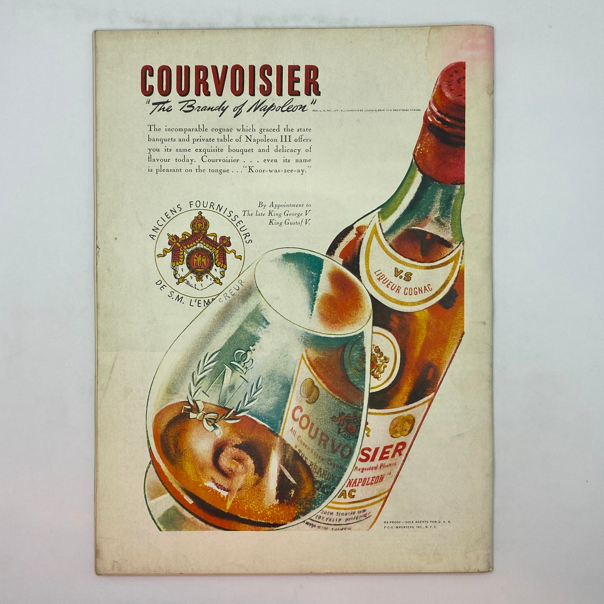 Advertisement page in The New Yorker Complete Magazine May 6, 1939 for Courvoisier cognac, depicting a vintage design featuring a wine glass and cognac bottle.