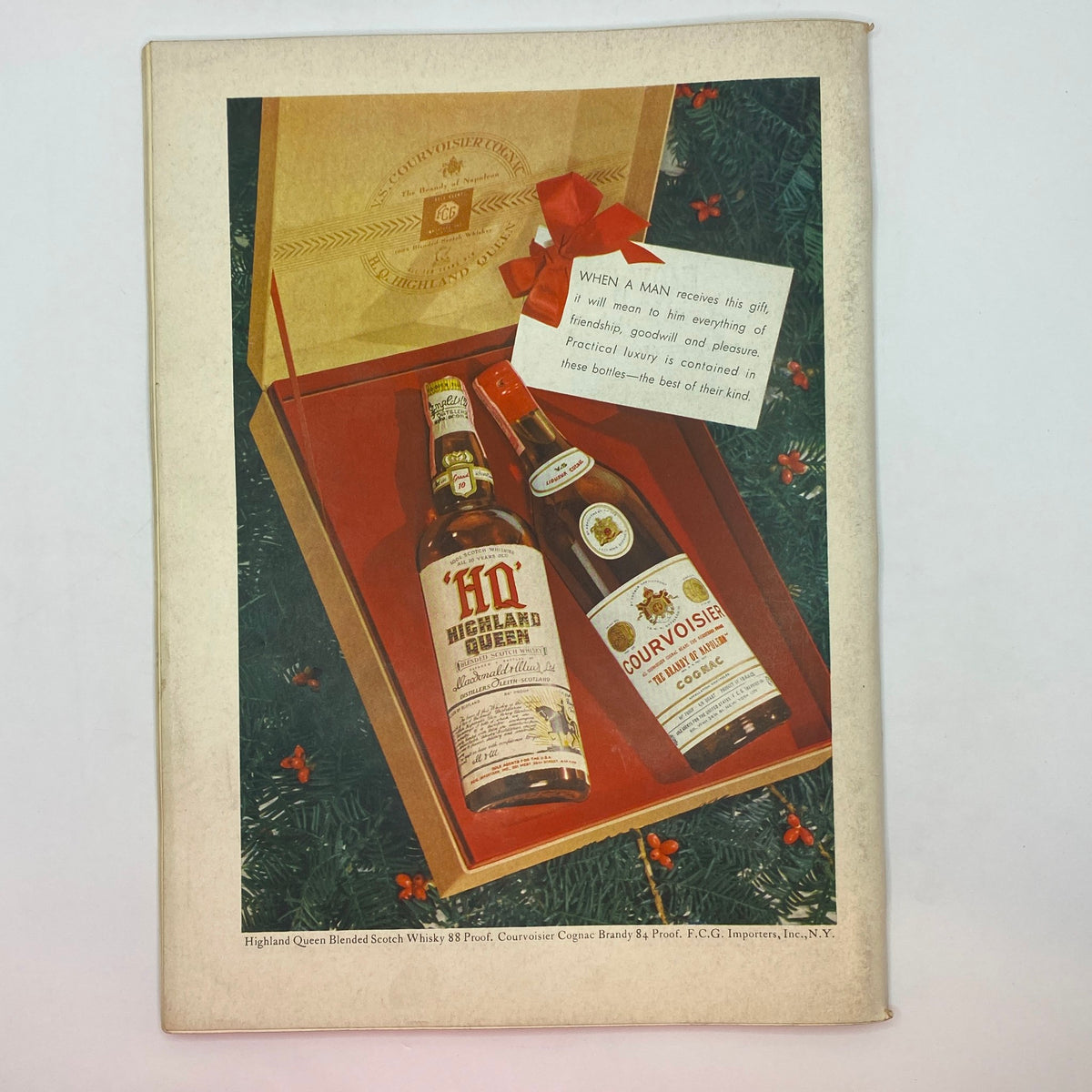 The New Yorker Complete Magazine December 9, 1939, depicting a festive advertisement for Highland Queen Scotch Whisky and Courvoisier Cognac, emphasizing luxury gifting.
