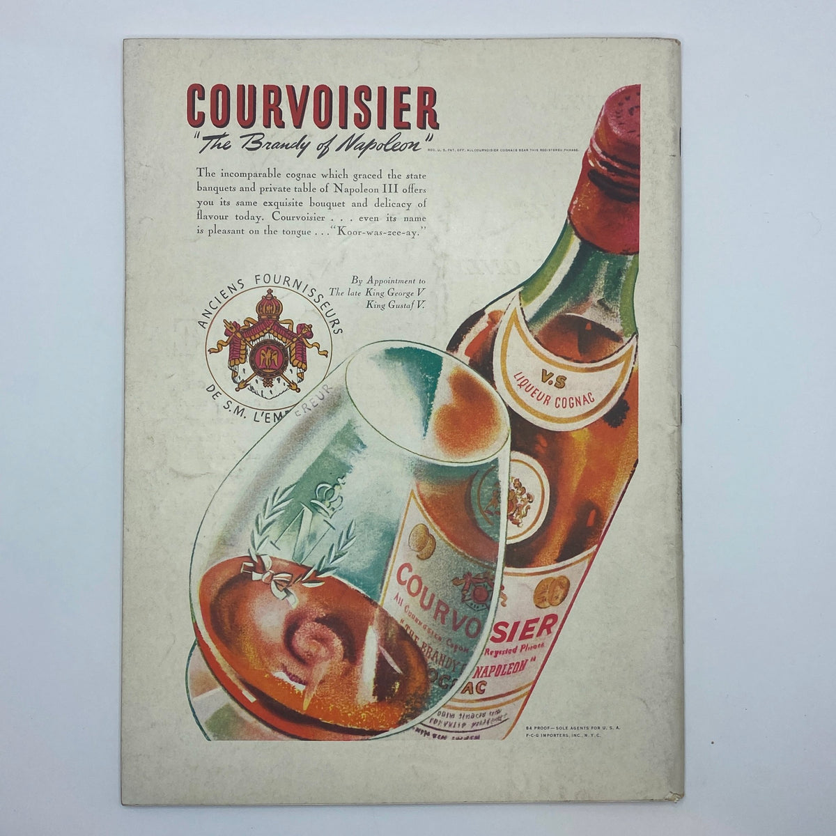 Advertisement for Courvoisier cognac in The New Yorker magazine from November 11, 1939, showcasing a bottle and glass of the beverage, emphasizing its high quality and historical significance.