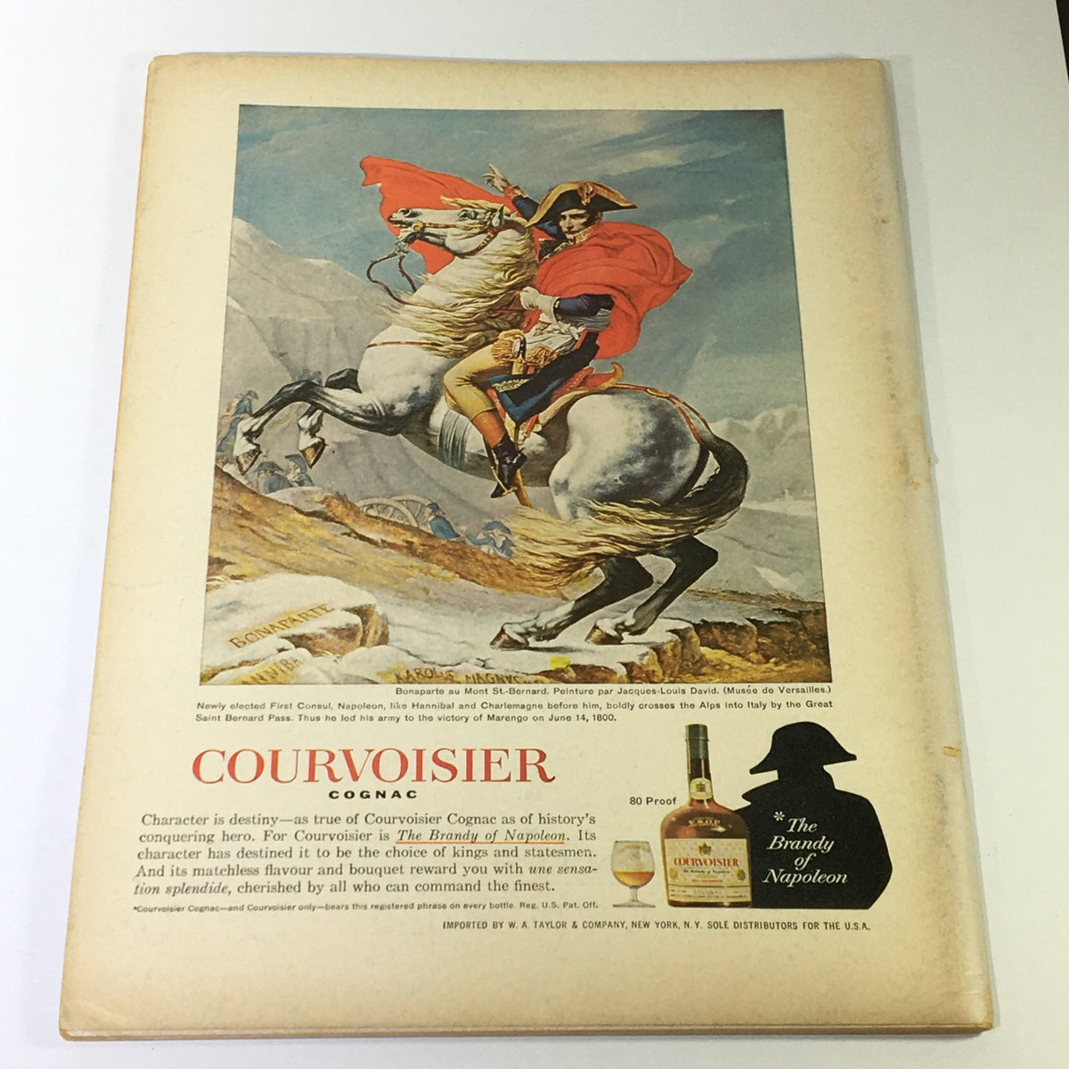 Back cover of Gourmet The Magazine of Good Living, December 1965, showcasing an advertisement for Courvoisier Cognac with an artistic depiction of Napoleon on horseback.