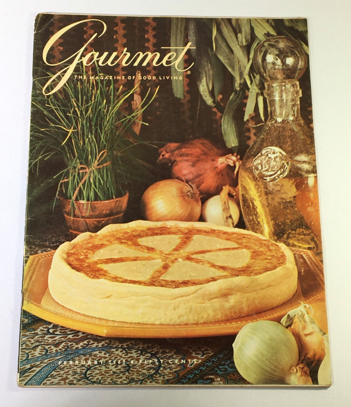VTG Gourmet Magazine Cover - February 1962 featuring a beautifully arranged dish on a decorative table, highlighting gourmet living.