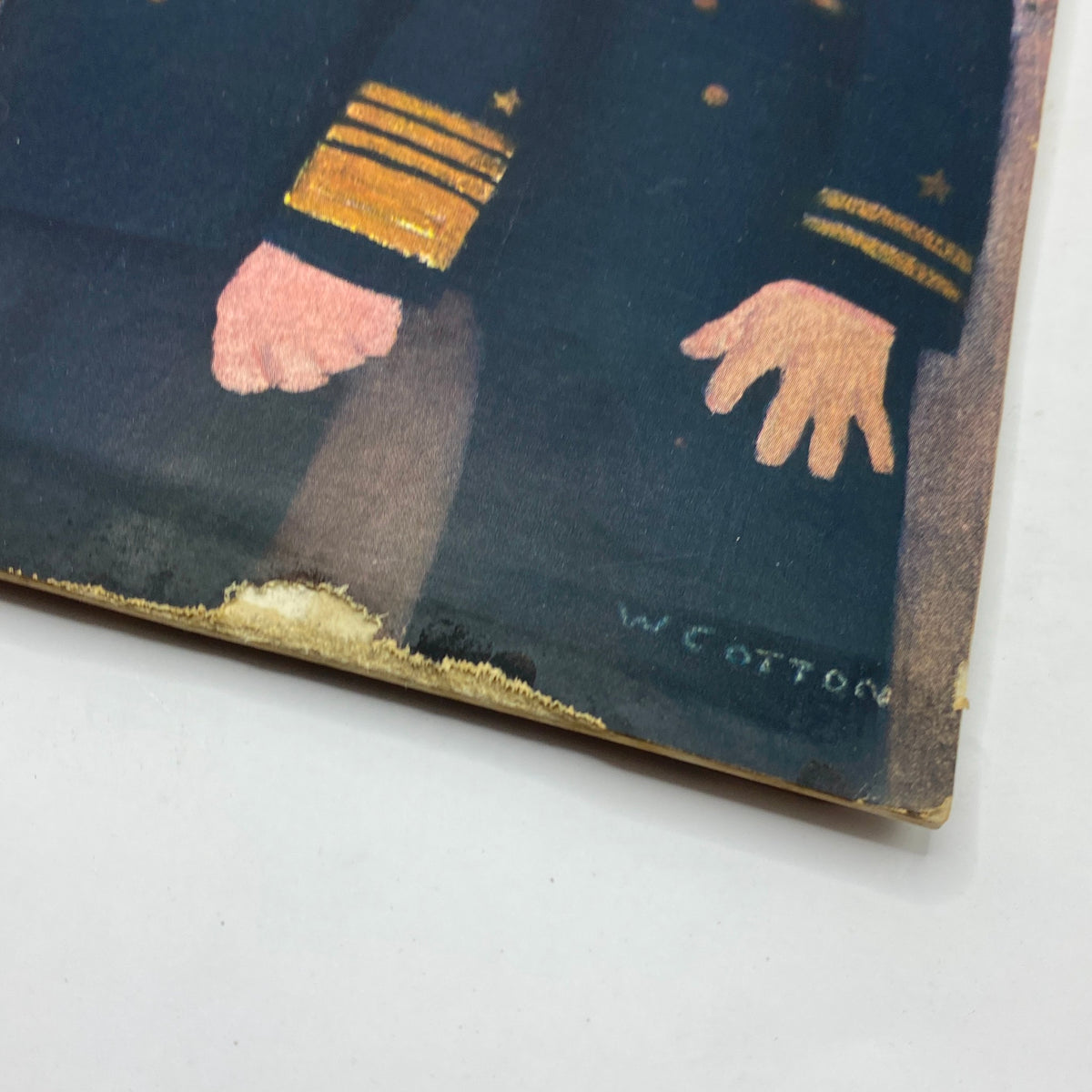 Close-up of the corner of The New Yorker Complete Magazine April 17, 1943 illustrating the signature of artist William Cotton.