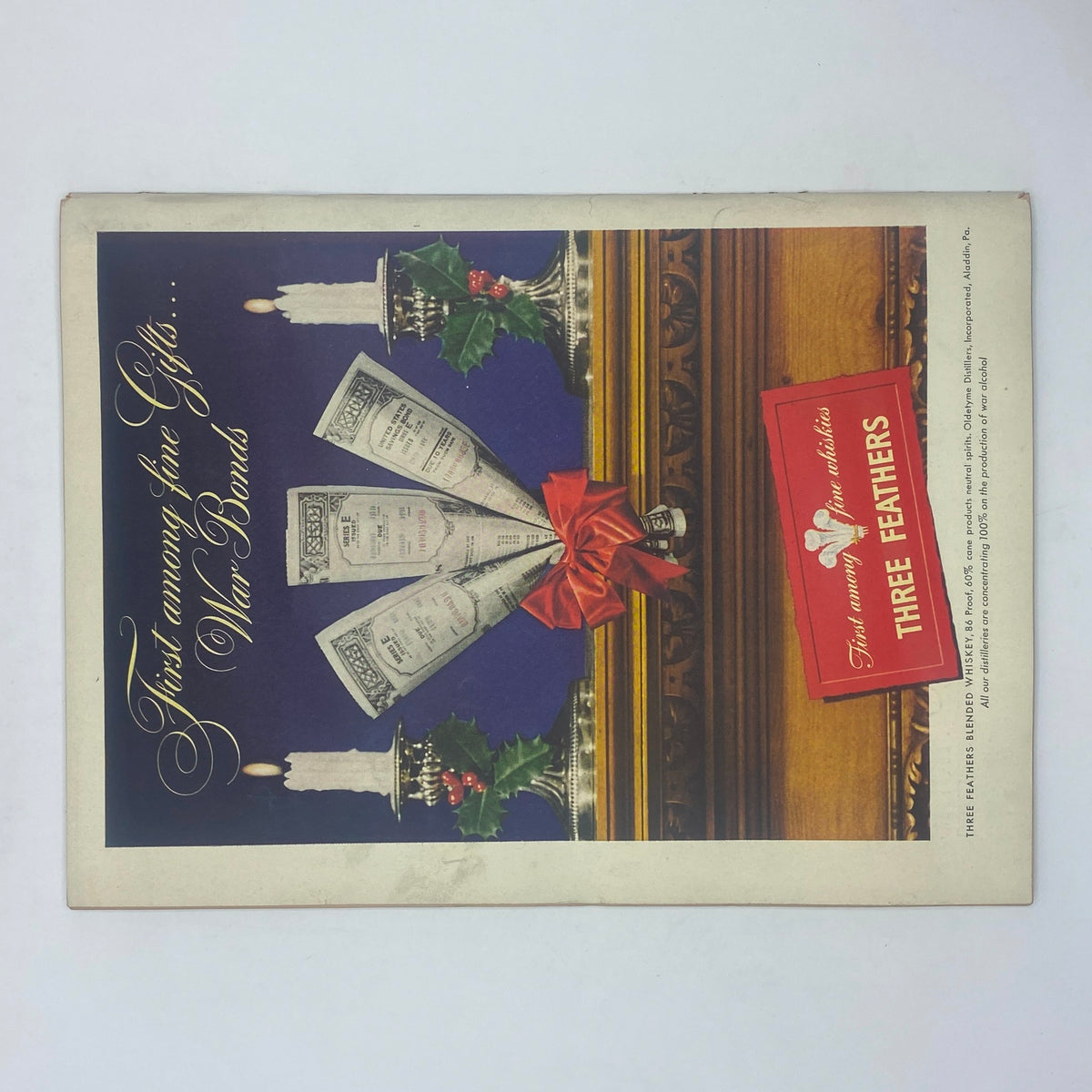 Cover of The New Yorker Complete Magazine December 4, 1943 featuring a vintage holiday advertisement showcasing US War Bonds with festive decorations and a Three Feathers whiskey advertisement.