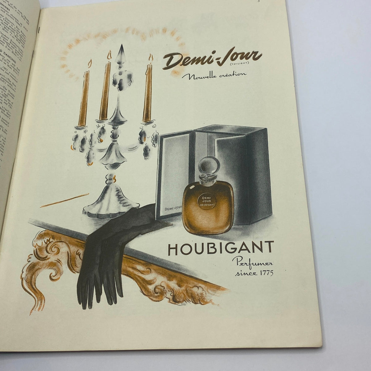 Advertisement page from The New Yorker Complete Magazine May 18, 1940 showcasing a vintage perfume ad for 'Demi Jour' by Houbiant, featuring elegant design with candles and gloves.
