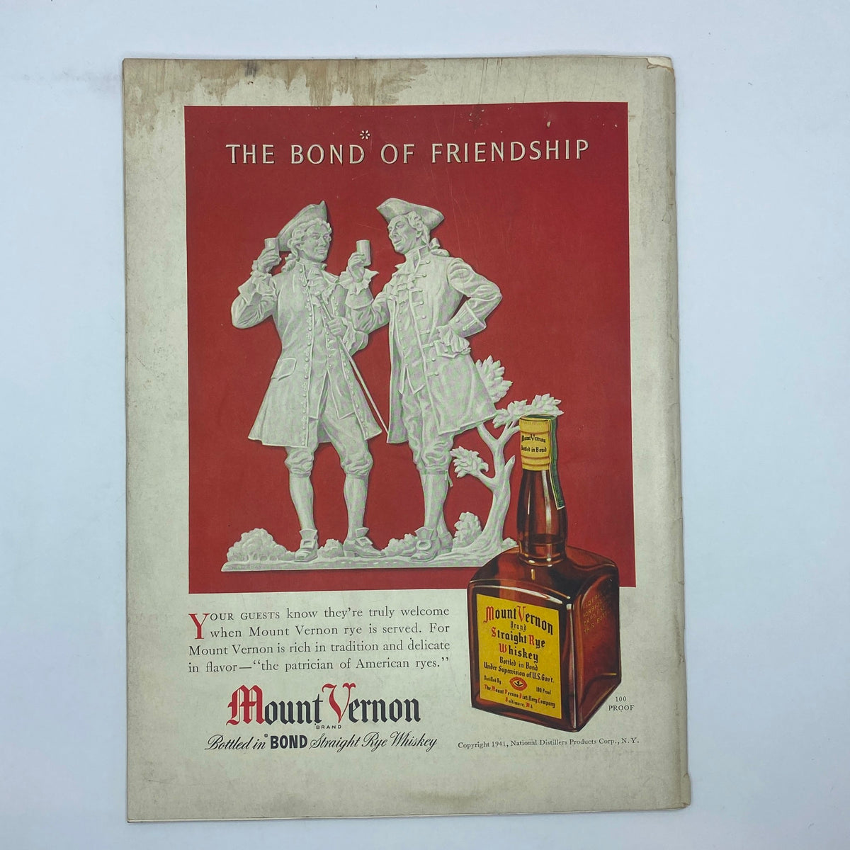 Vintage advertisement for Mount Vernon Rye Whiskey in The New Yorker from December 27, 1941, illustrating the bond of friendship with artistic characters and product display.