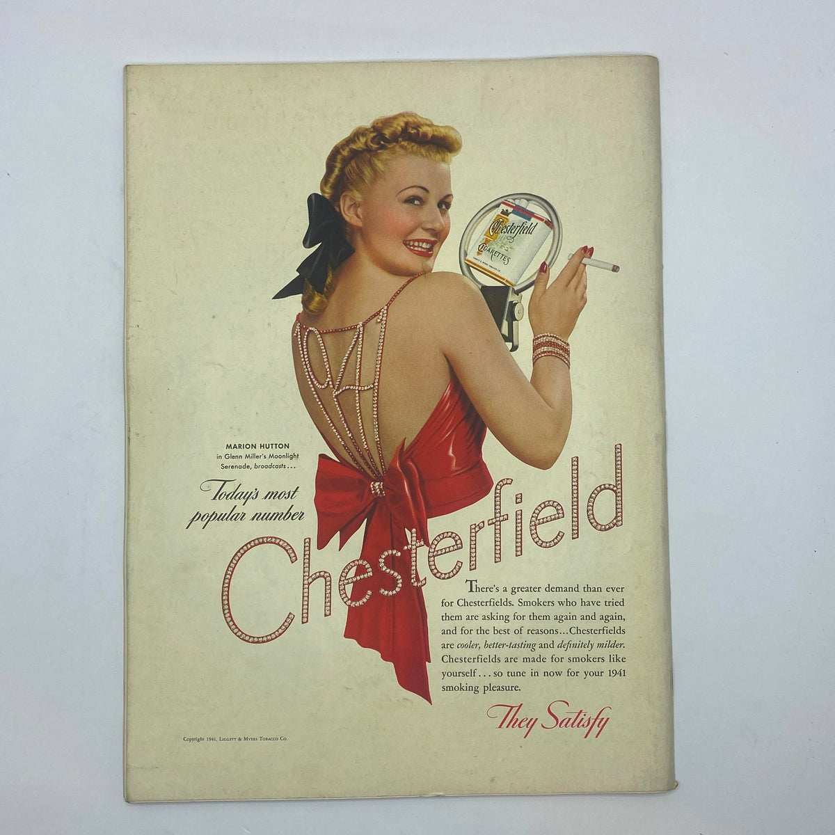 Vintage advertisement featuring Marion Hutton promoting Chesterfield cigarettes, renowned for its glamorous retro aesthetic, in the style of The New Yorker Complete Magazine January 11, 1941.