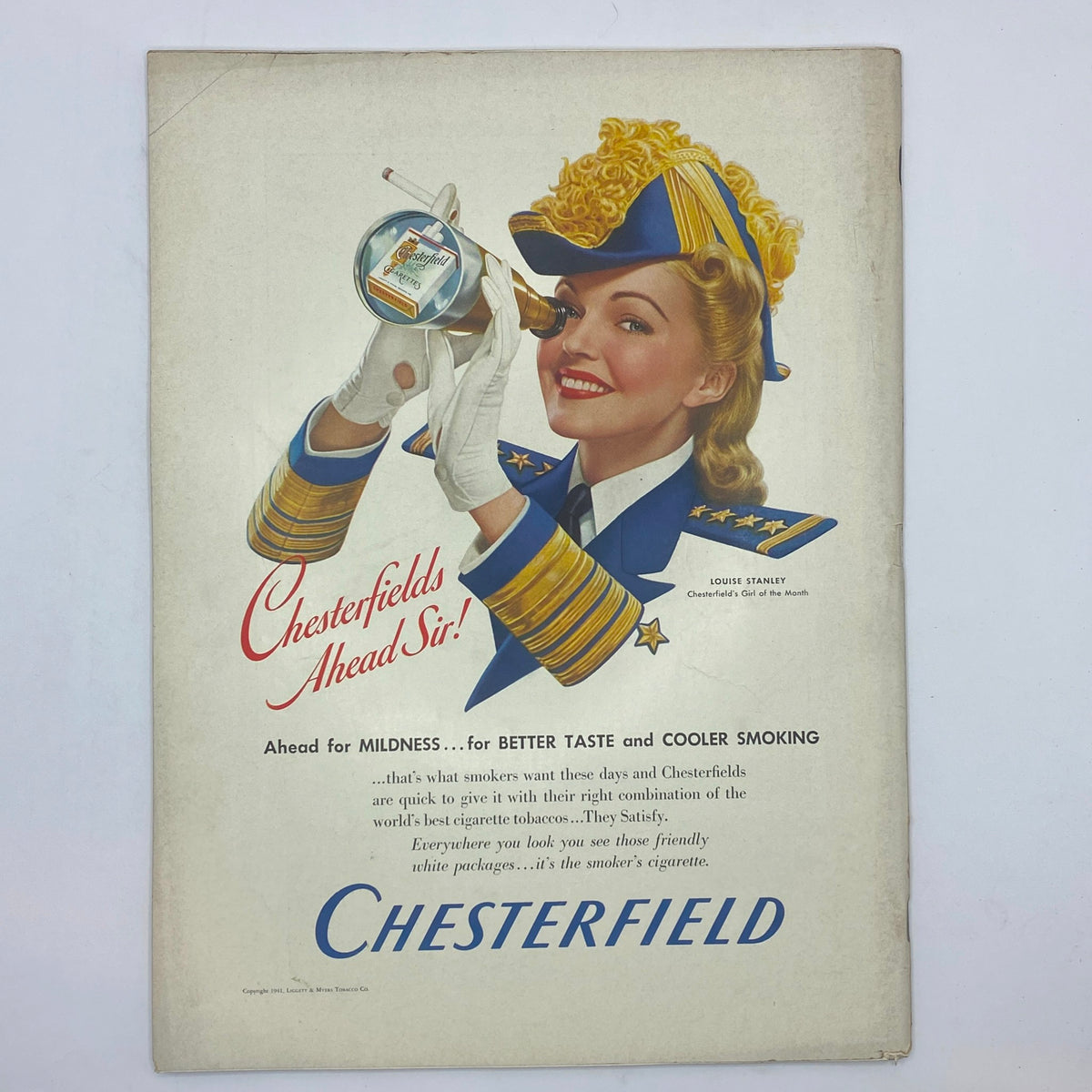 Vintage cigarette advertisement for Chesterfield cigarettes featuring a smiling woman in a military-style uniform in The New Yorker March 29, 1941 issue.