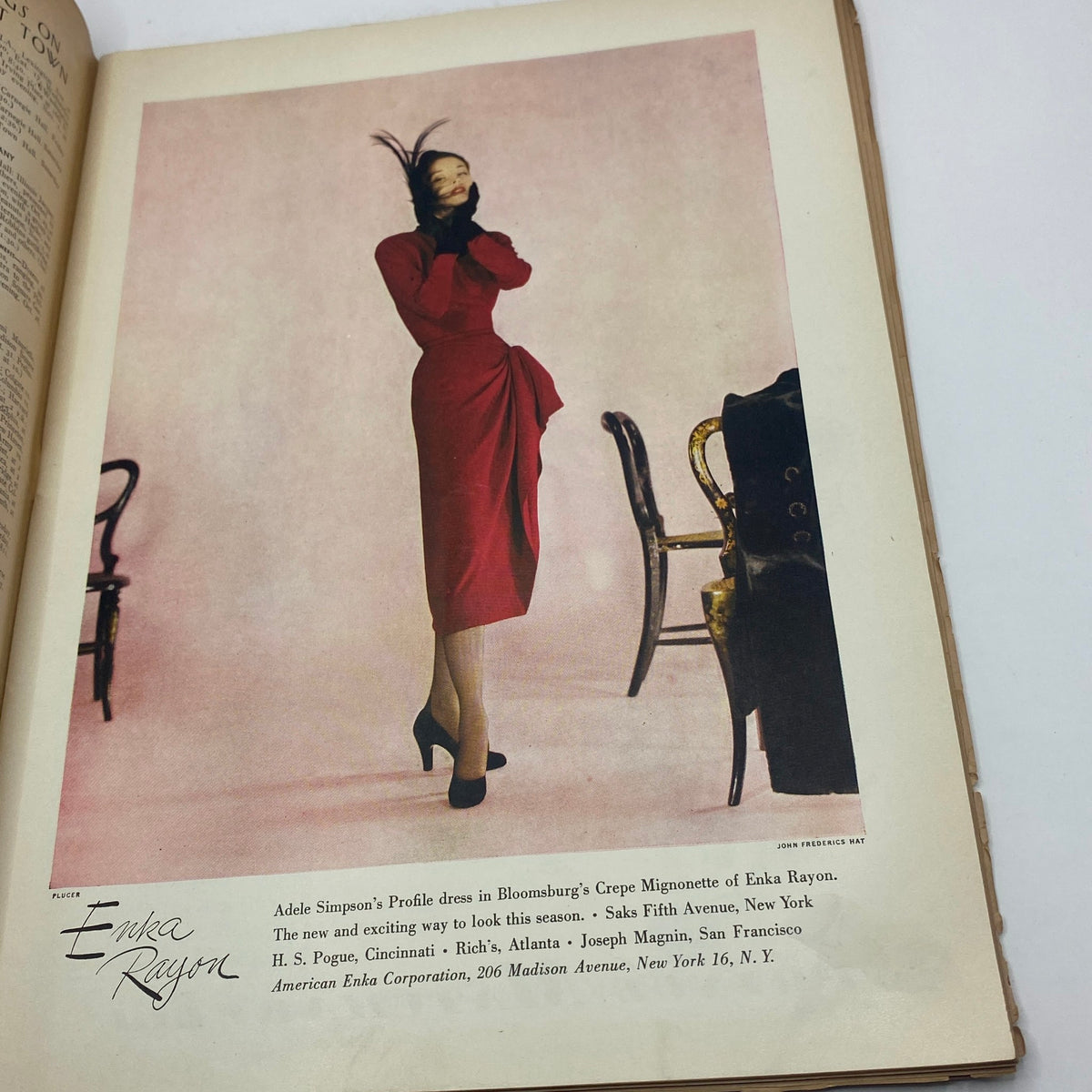 Interior fashion advertisement from The New Yorker Complete Magazine October 25, 1947 featuring a model showcasing an elegant red dress by Enka Rayon.