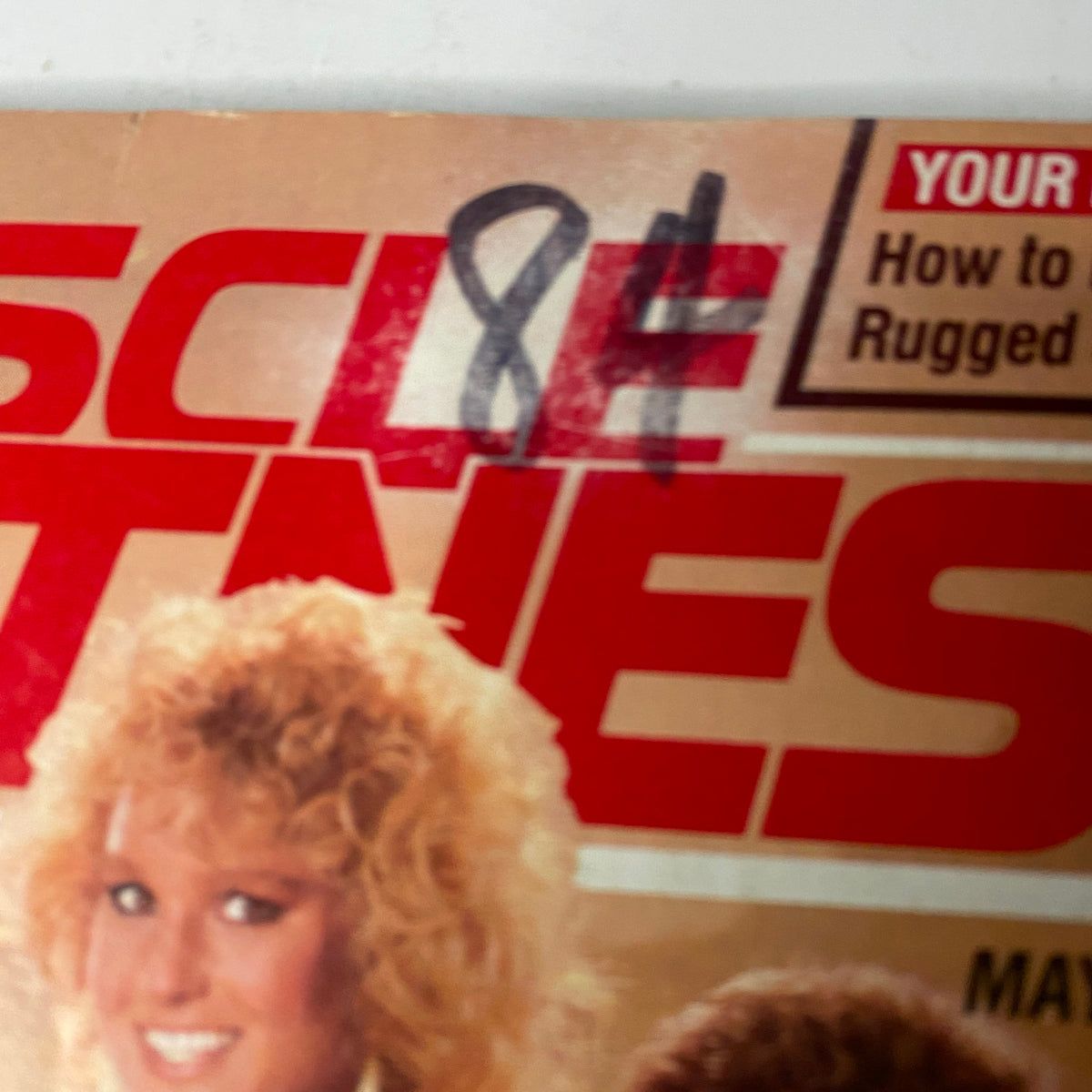 Close-up of Muscle & Fitness Magazine cover from May 1984, highlighting the title with an emphasis on fitness and strength themes.