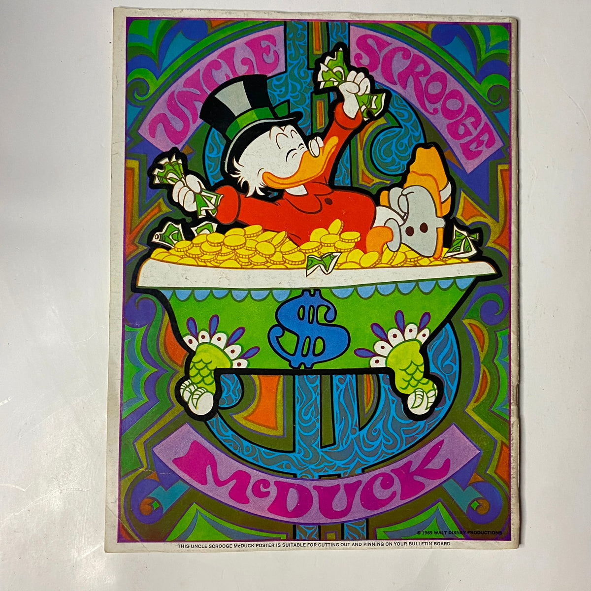 Colorful illustration of Uncle Scrooge McDuck happily swimming in a vault of gold coins, surrounded by dollar bills, capturing the essence of the Wonderful World of Disney 1969 No. 3 101 Dalmatians, Michael Collins