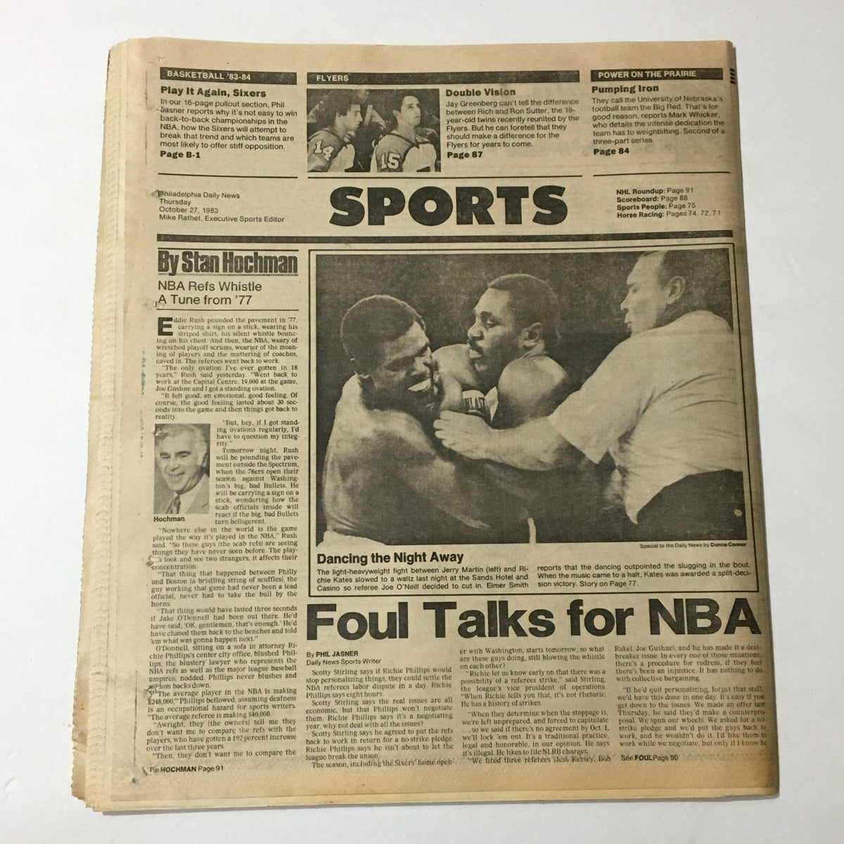 Philadelphia Daily News from October 27, 1983 showcasing the sports section with coverage of the Philadelphia 76ers and the NBA, along with the Sixers Iron-On, highlighting the significant moments in basketball history.