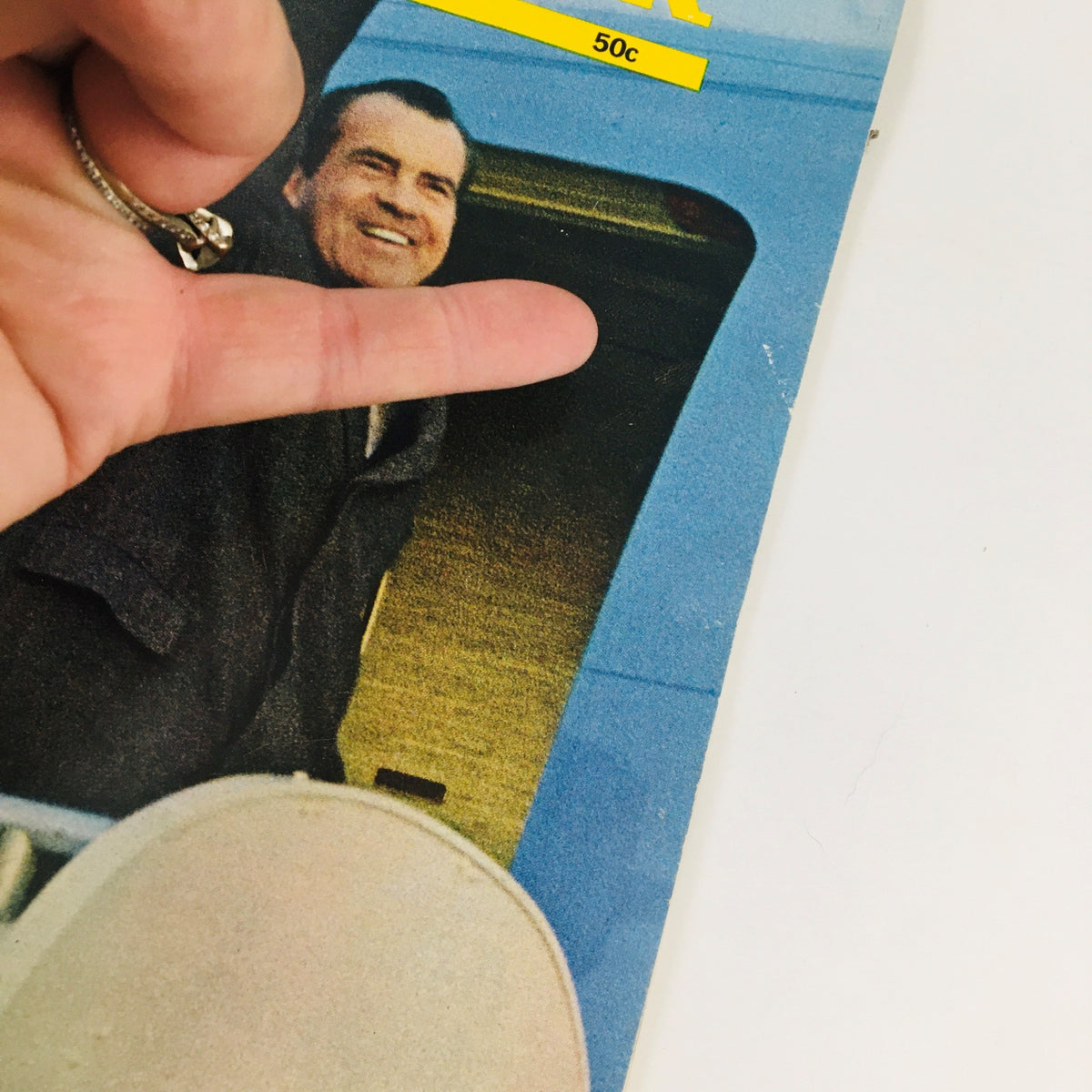 Close-up of the cover of Newsweek Magazine from March 3, 1969 highlighting Mr. Nixon's visit to Europe with a hand pointing at the image.