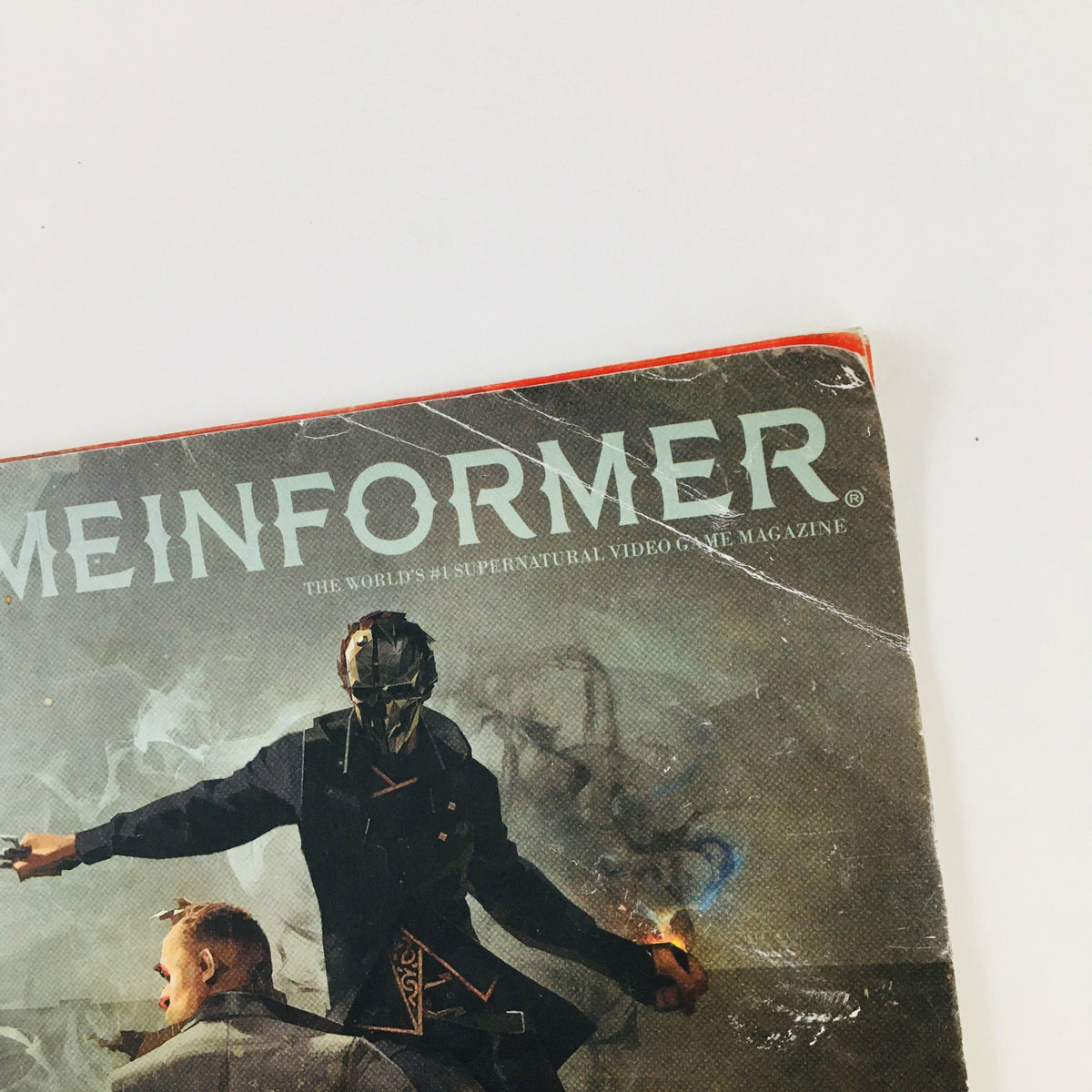 Close-up of Game Informer Magazine June 2016 Issue 278 cover, highlighting the title and detail of the Dishonored 2 artwork.