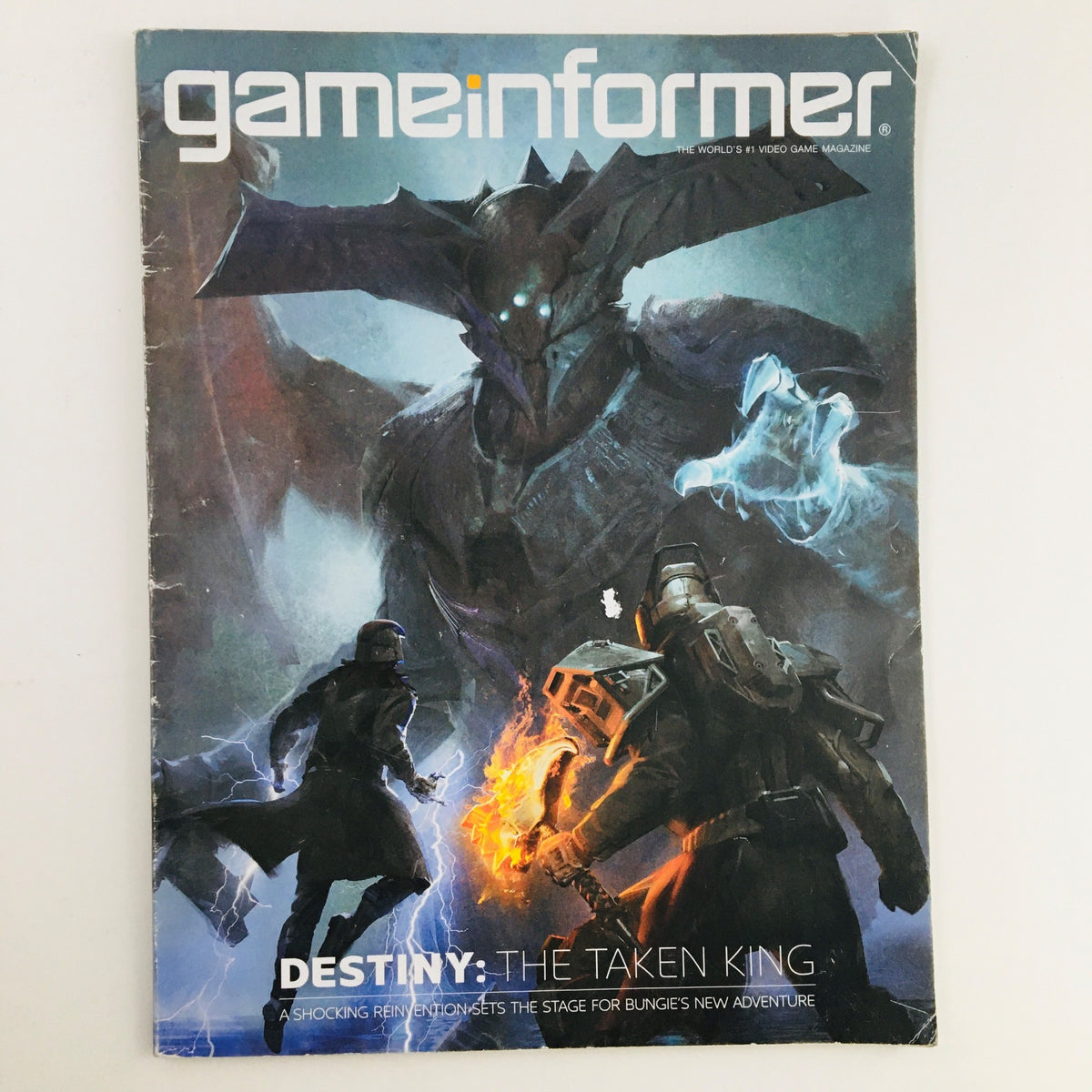 Game Informer Magazine September 2015 Issue 269 cover featuring Destiny: The Taken King, showcasing iconic characters and artwork from the game.