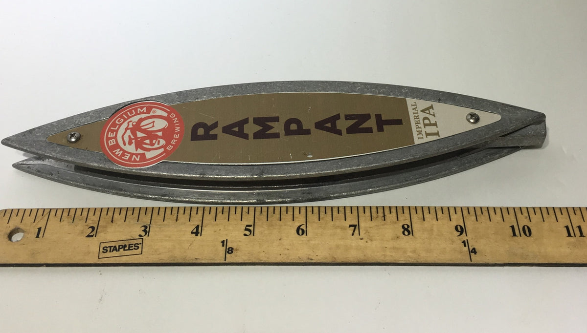 Vintage New Belgium Brewing Rampant Imperial IPA 11" Beer Tap Handle displayed horizontally next to a ruler for scale, highlighting the tap handle's distinctive shape and branding.