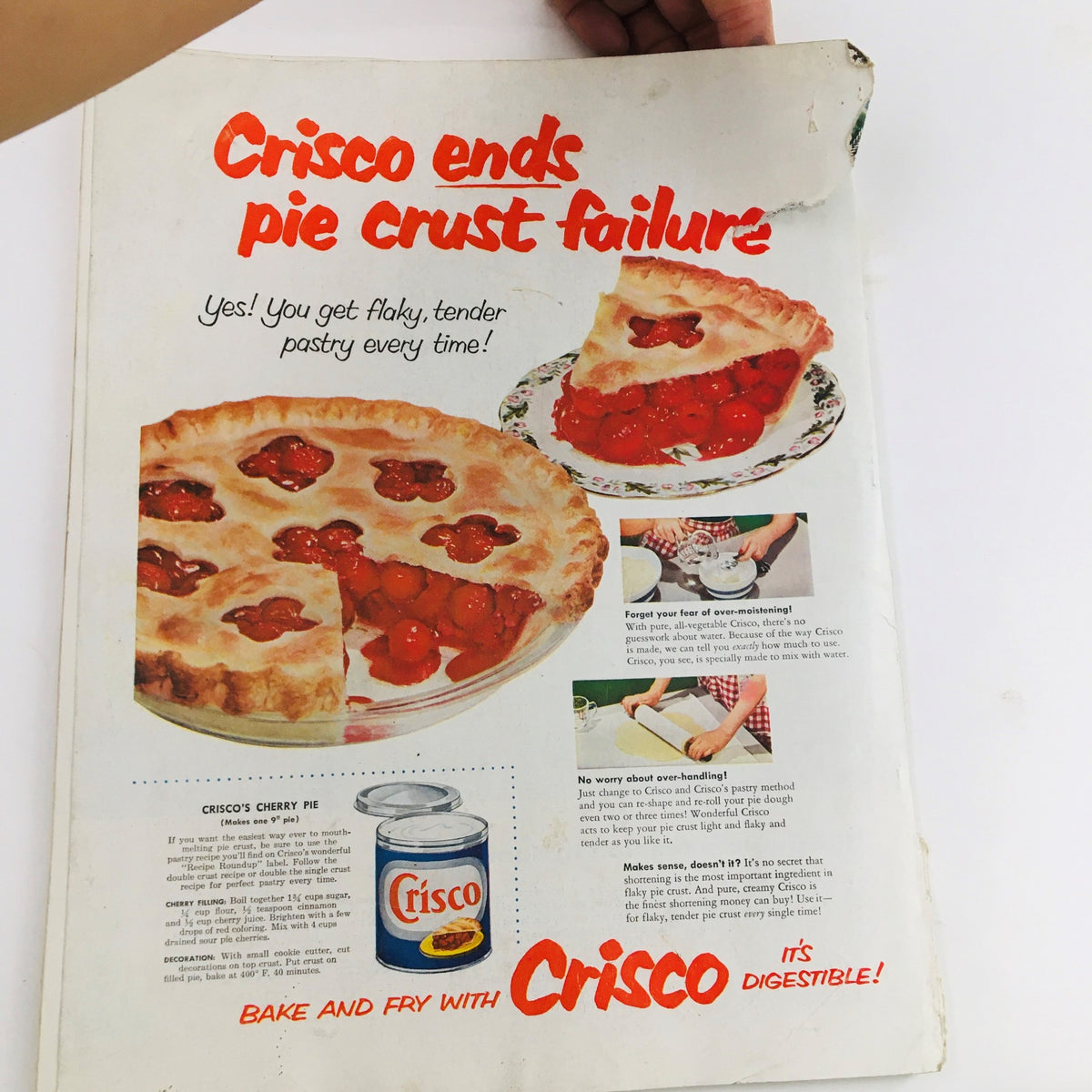 Crisco advertisement from Woman's Home Companion October 1954 featuring a cherry pie and tips for perfect pie crusts, highlighting that Crisco ends pie crust failure.