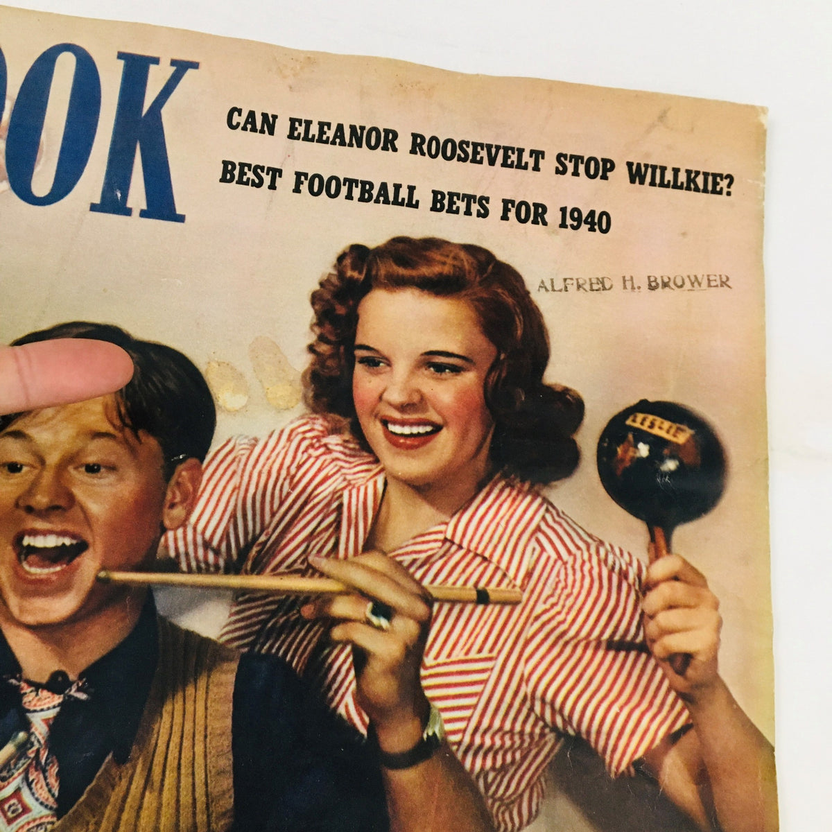 Close-up view of Look Magazine's cover from October 8, 1940, highlighting Judy Garland and Mickey Rooney in a festive atmosphere.