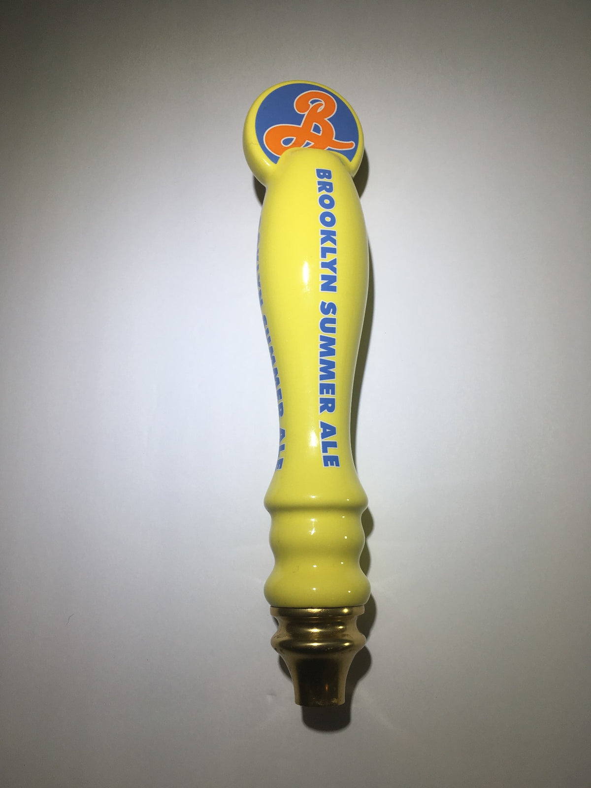 Side view of Vintage Brooklyn Summer Ale 12½" beer tap handle in yellow, showcasing detailed design and branding, ideal for bar or home decor.