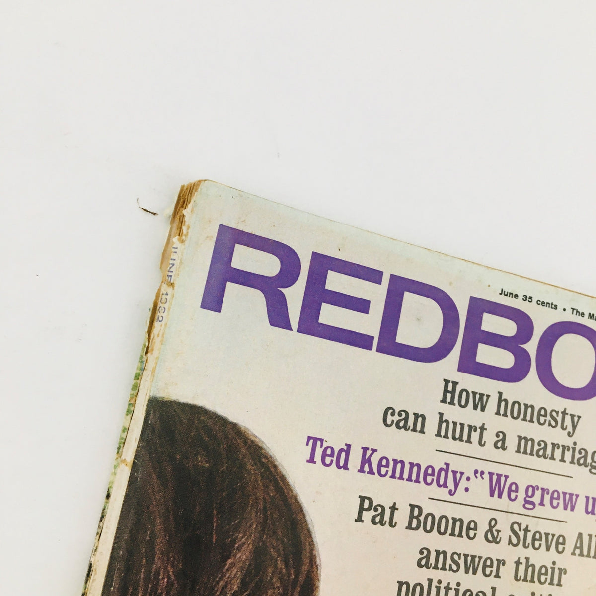 Close-up image of the cover of Redbook Magazine June 1962, highlighting the title and main themes including marriage and political commentary.