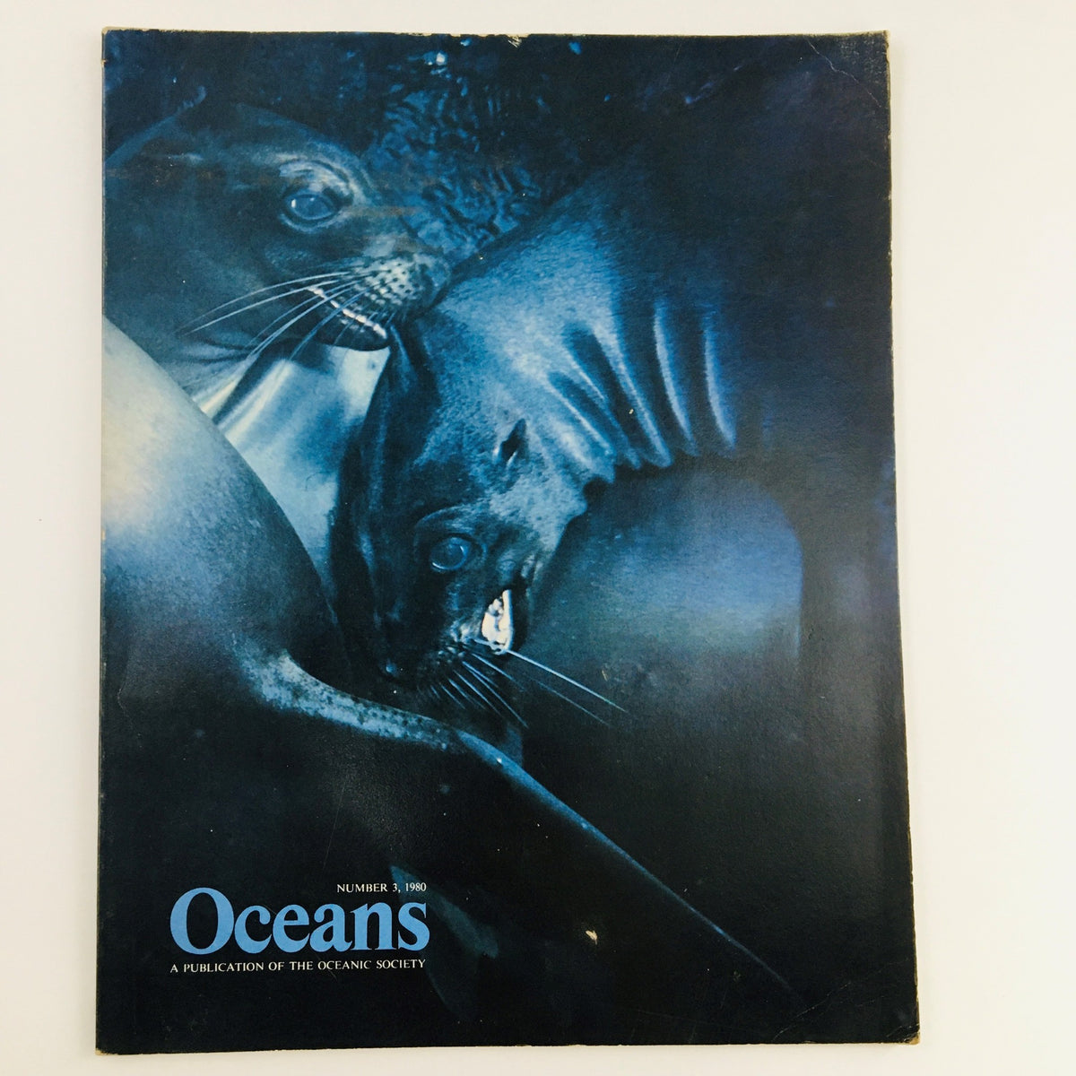 Cover of Oceans Magazine May 1980, Vol 13 No. 3 featuring a Trio of Galapagos Sea Lions, showcasing marine wildlife photography.