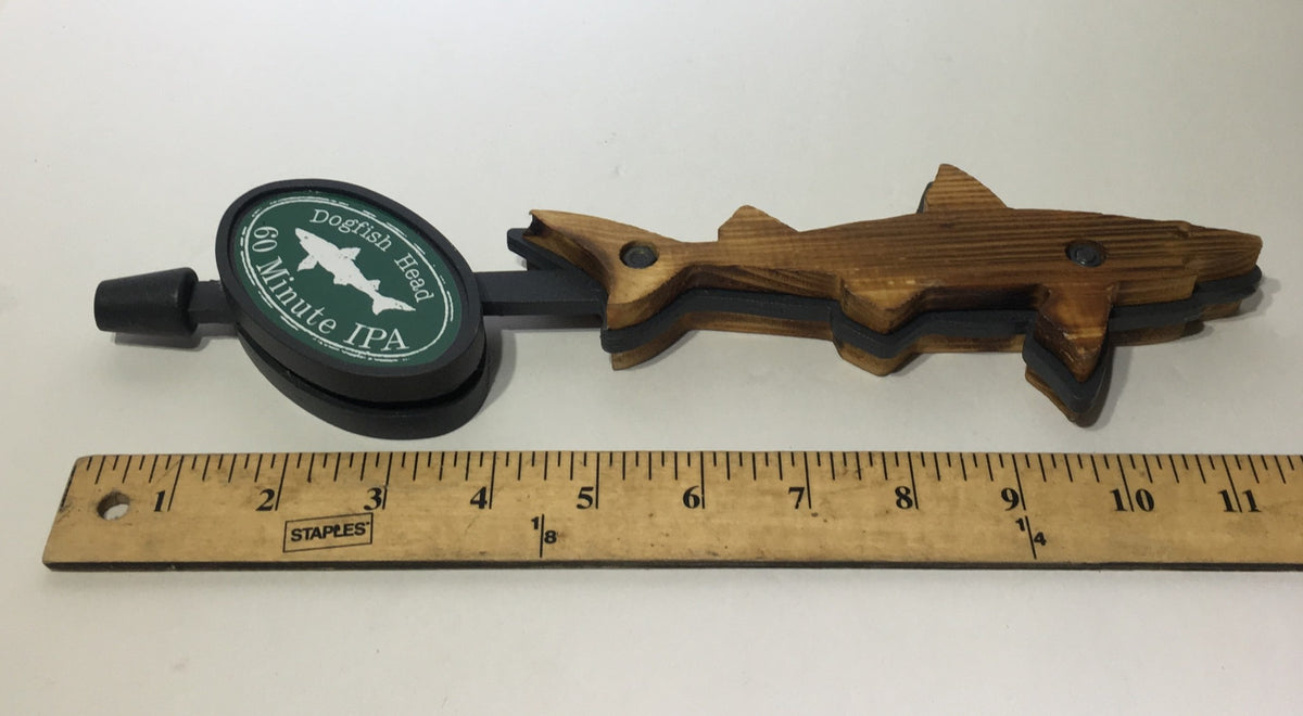 Side view of Vintage Dogfish Head 60 Minute IPA 12" Beer Tap Handle showing its intricate wooden shark shape and associated tap mechanism.