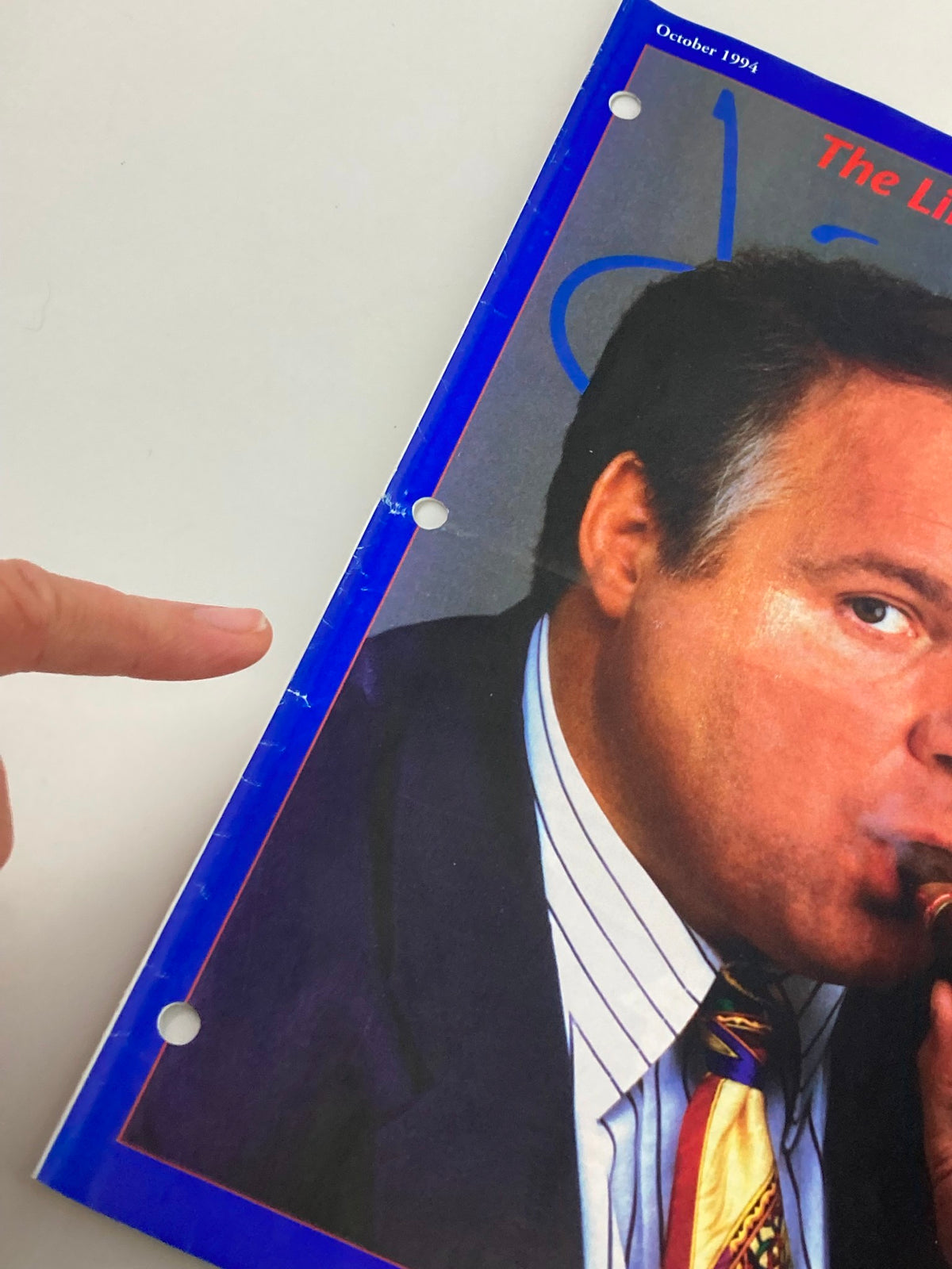 Side view of the Rush Limbaugh Letter Newsletter Magazine from October 1994 showing a close-up of the cover with Rush Limbaugh, highlighting a finger pointing towards the hole-punched side.