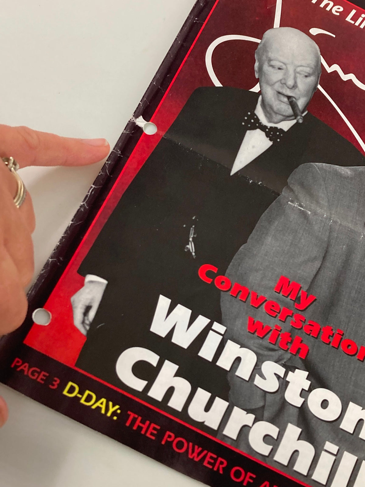 Close-up view of the Rush Limbaugh Letters Newsletter Magazine June 1994 cover displaying a portion of the headline 'My Conversation with Winston Churchill' alongside a finger pointing to the left margin.