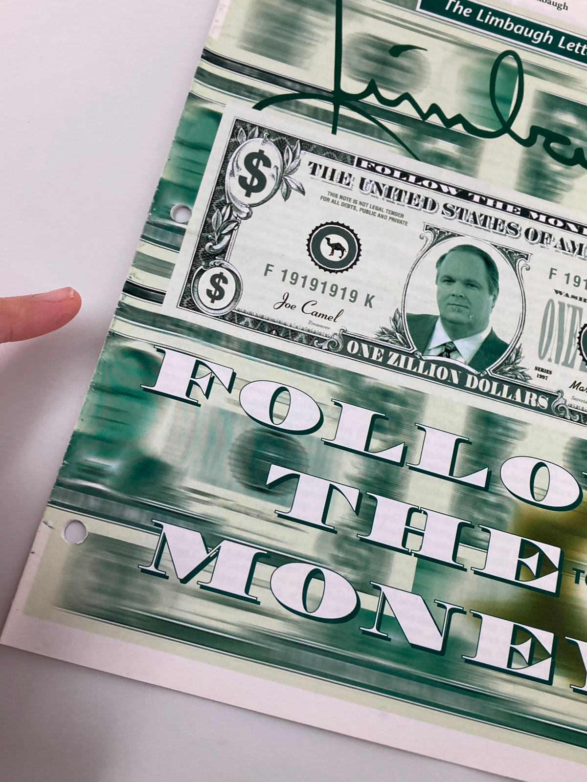 Close-up view of the cover of the Rush Limbaugh Letter Newsletter Magazine from August 1997, highlighting the 'Follow the Money' theme connected to the Tobacco Deal, showing artistic signature and faux bill details.