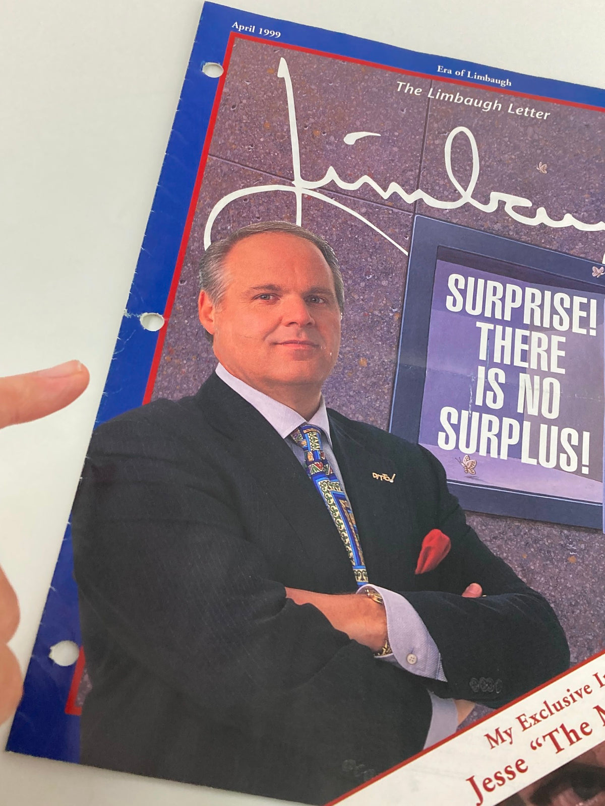 Close-up view of the Rush Limbaugh Letter Newsletter Magazine April 1999, showcasing Jesse 'The Mind' Ventura on the cover, emphasizing the title 'SURPRISE! THERE IS NO SURPLUS!'. This collectible magazine encapsulates late 1990s political discourse.