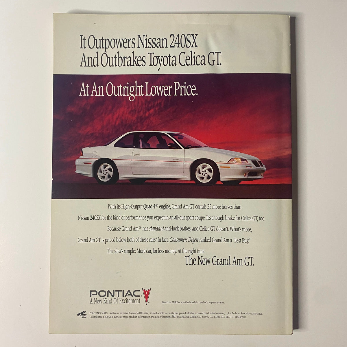 Auto advertisement from Muscle & Fitness Magazine June 1992 showcasing the Pontiac Grand Am GT, emphasizing its performance advantages over competitors like Nissan and Toyota.
