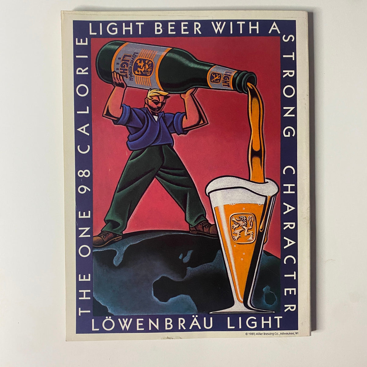 Vintage advertisement for Löwenbräu Light beer showcasing a man pouring beer into a glass with a strong emphasis on its low calorie count.
