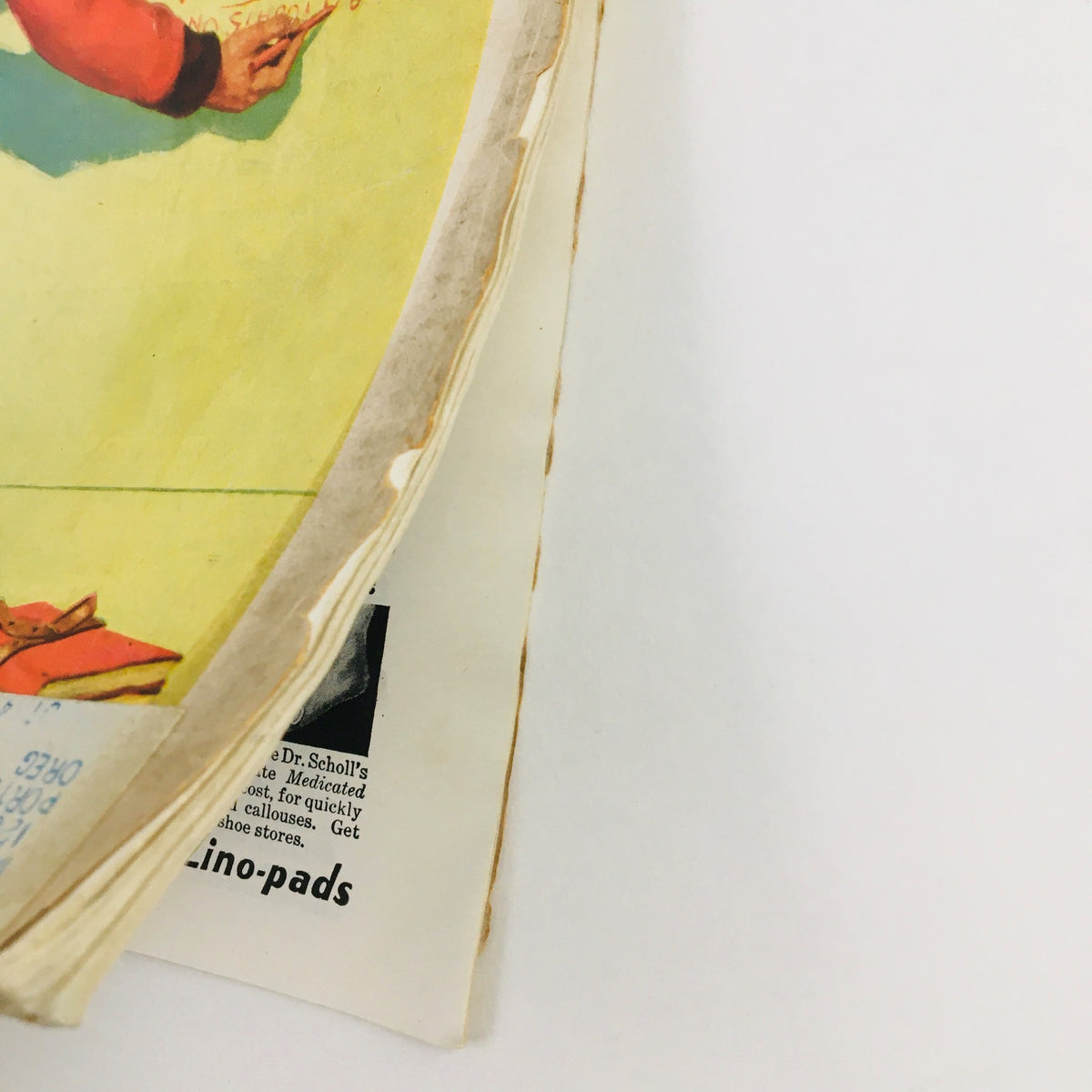 Side view of The American Magazine January 1933 showing the vintage magazine cover with calendar graphics and wear reflecting its historical significance.