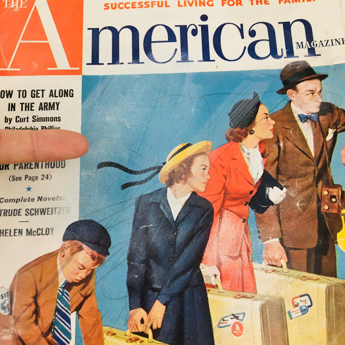 Close-up of the cover of The American Magazine, June 1952, showcasing the title 'How To Get Along In The Army' by Curt Simmons, with emphasis on characters carrying suitcases.